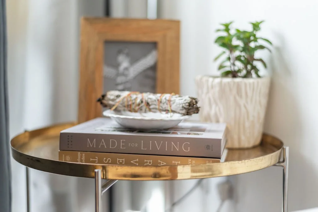 Coffee table with books and plants, interior design photography Nova Scotia