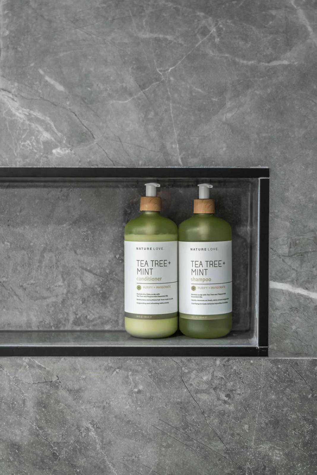 Grey stone shower niche with shampoo bottles, Nova Scotia interior design photographer