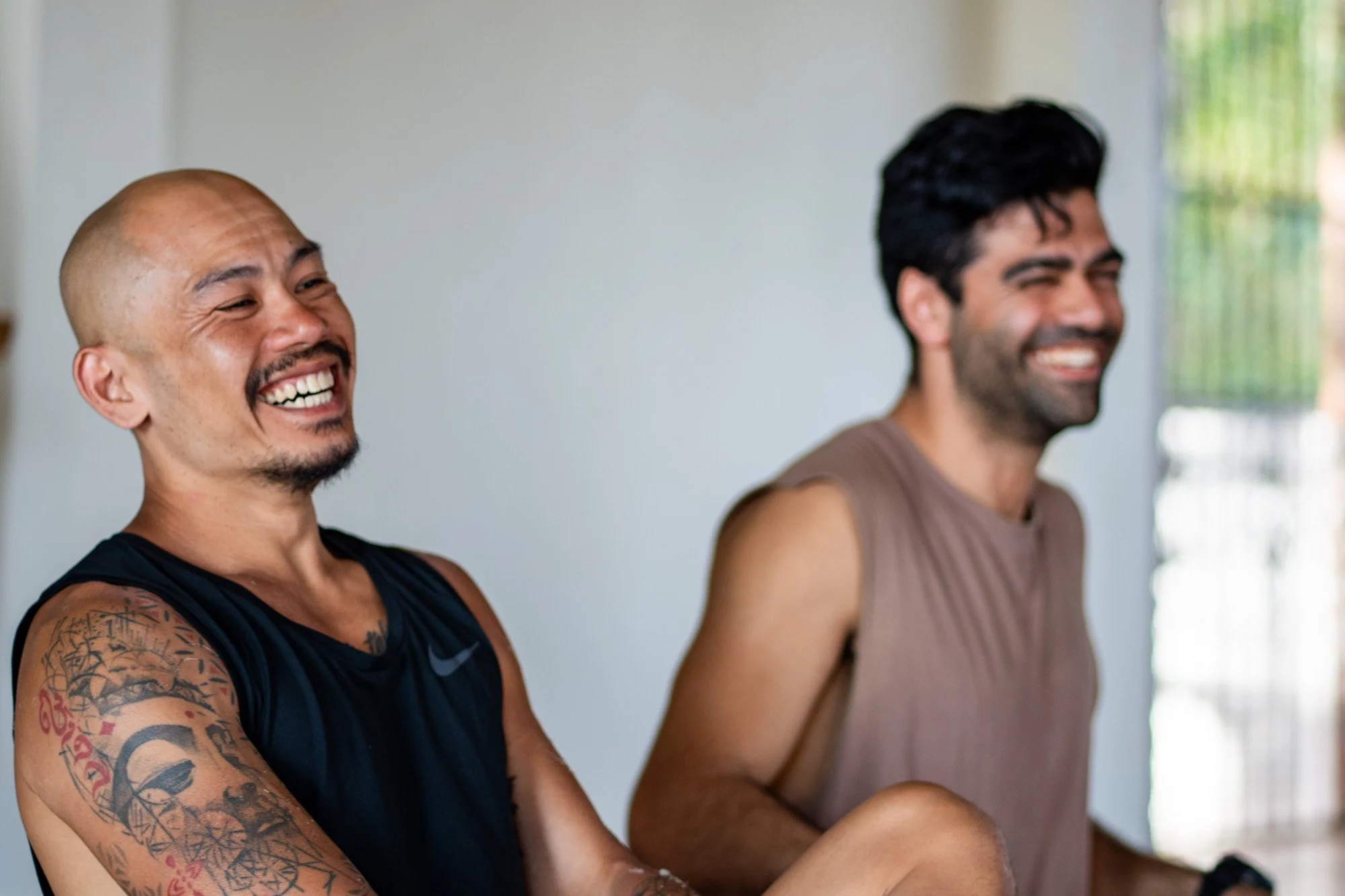 Guests laughing during retreat session, candid wellness retreat photography Nova Scotia