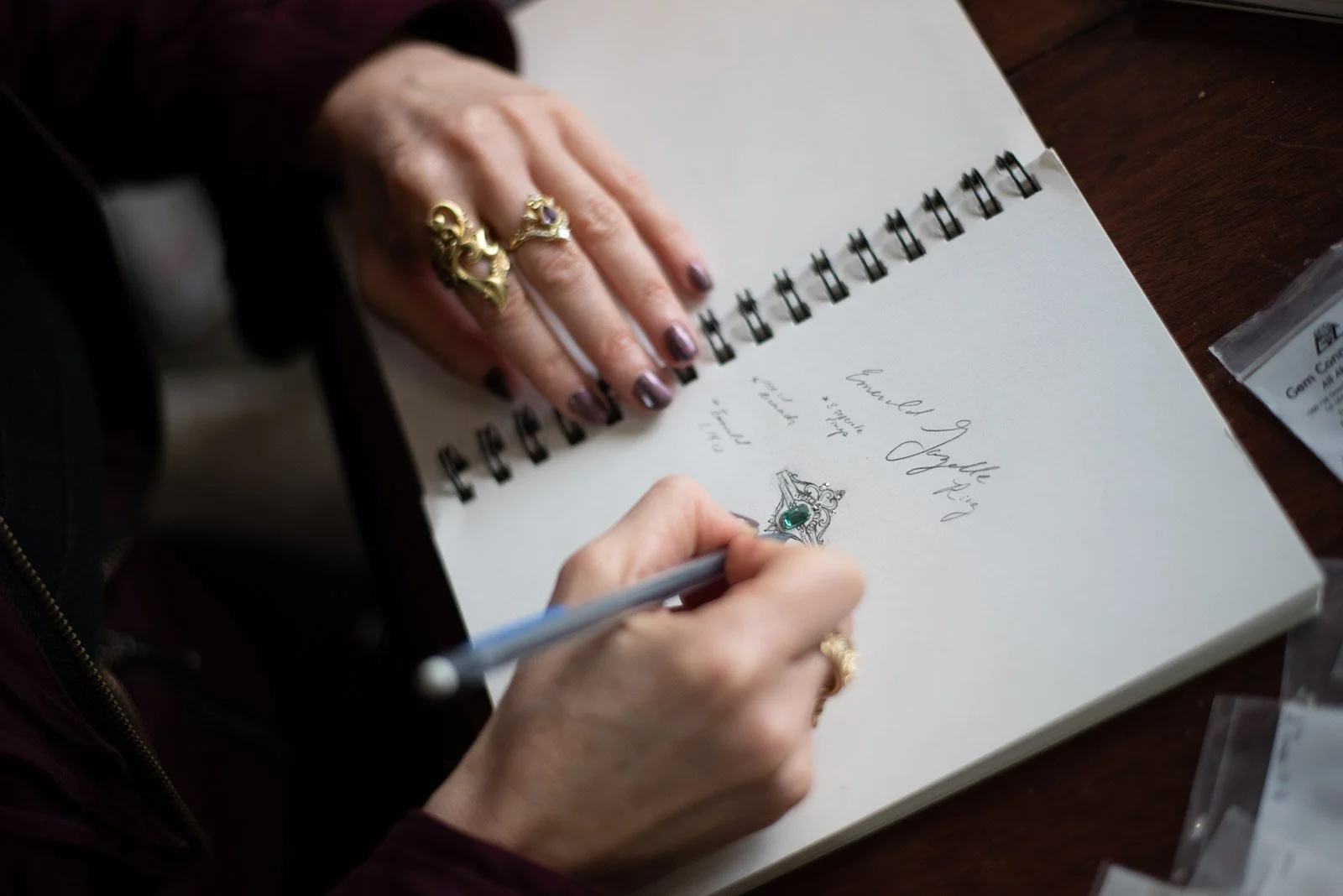 Jewelry designer sketching ring design, small business photography South Shore, Nova Scotia