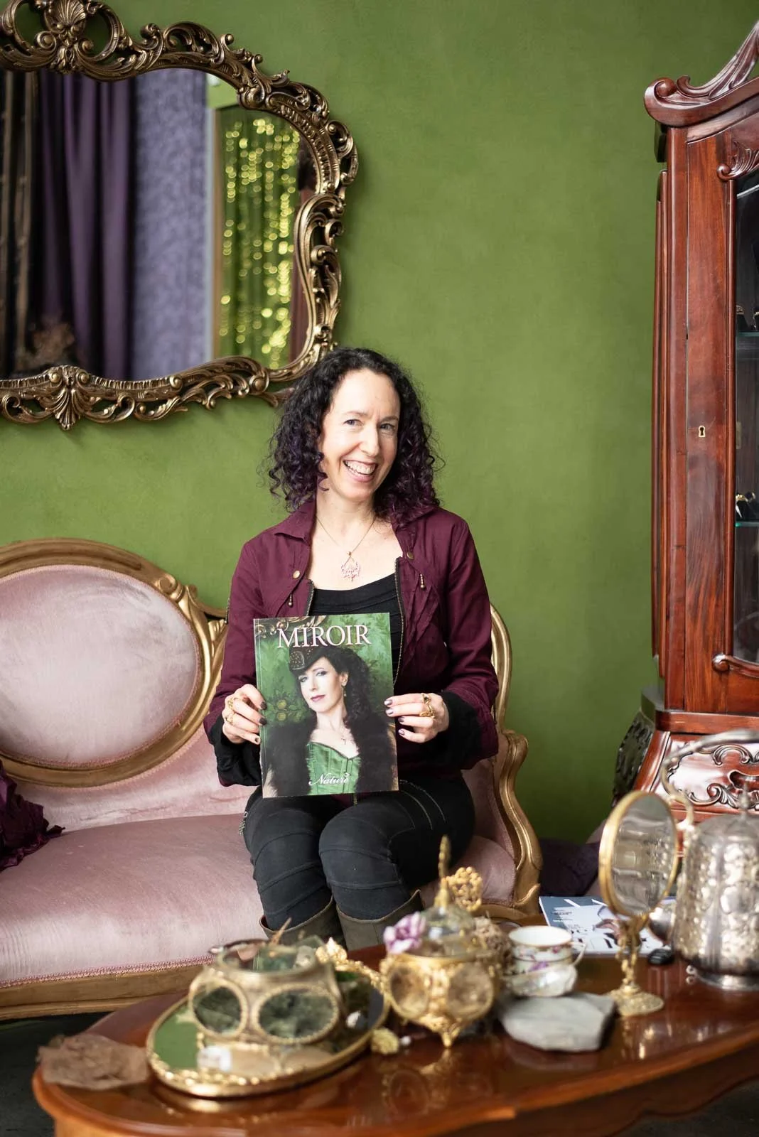 Branding photo of author with magazine in elegant living room