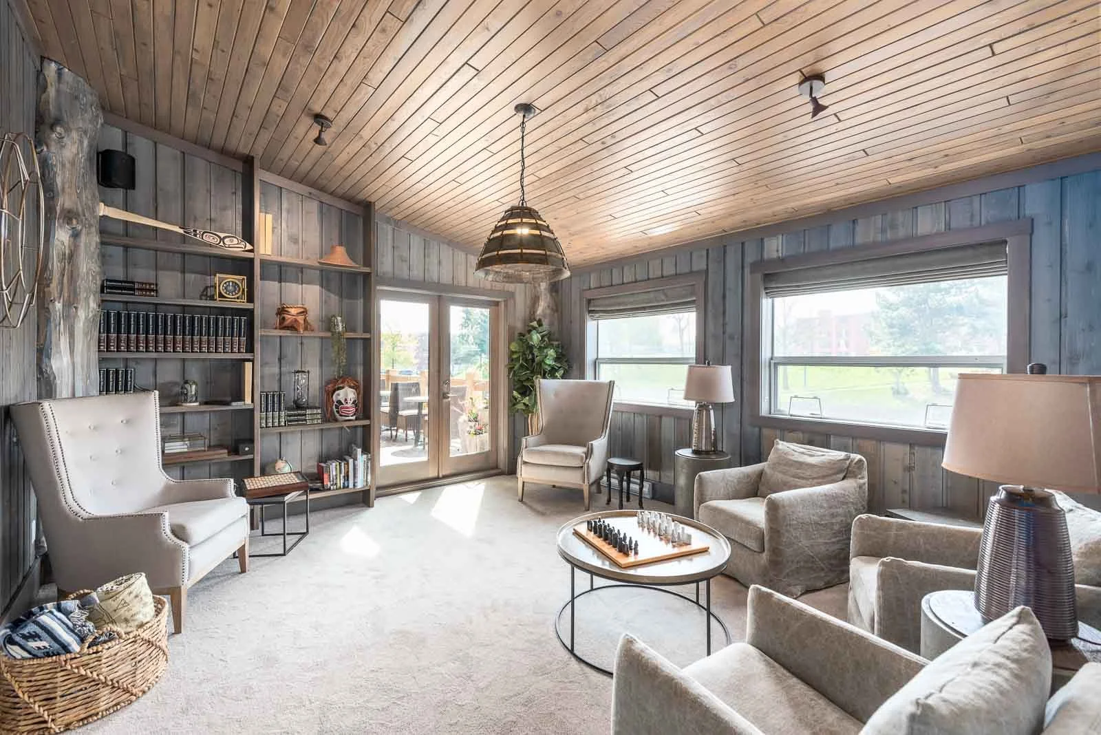 Elegant lounge with wood ceiling and grey chairs, interior photography Nova Scotia