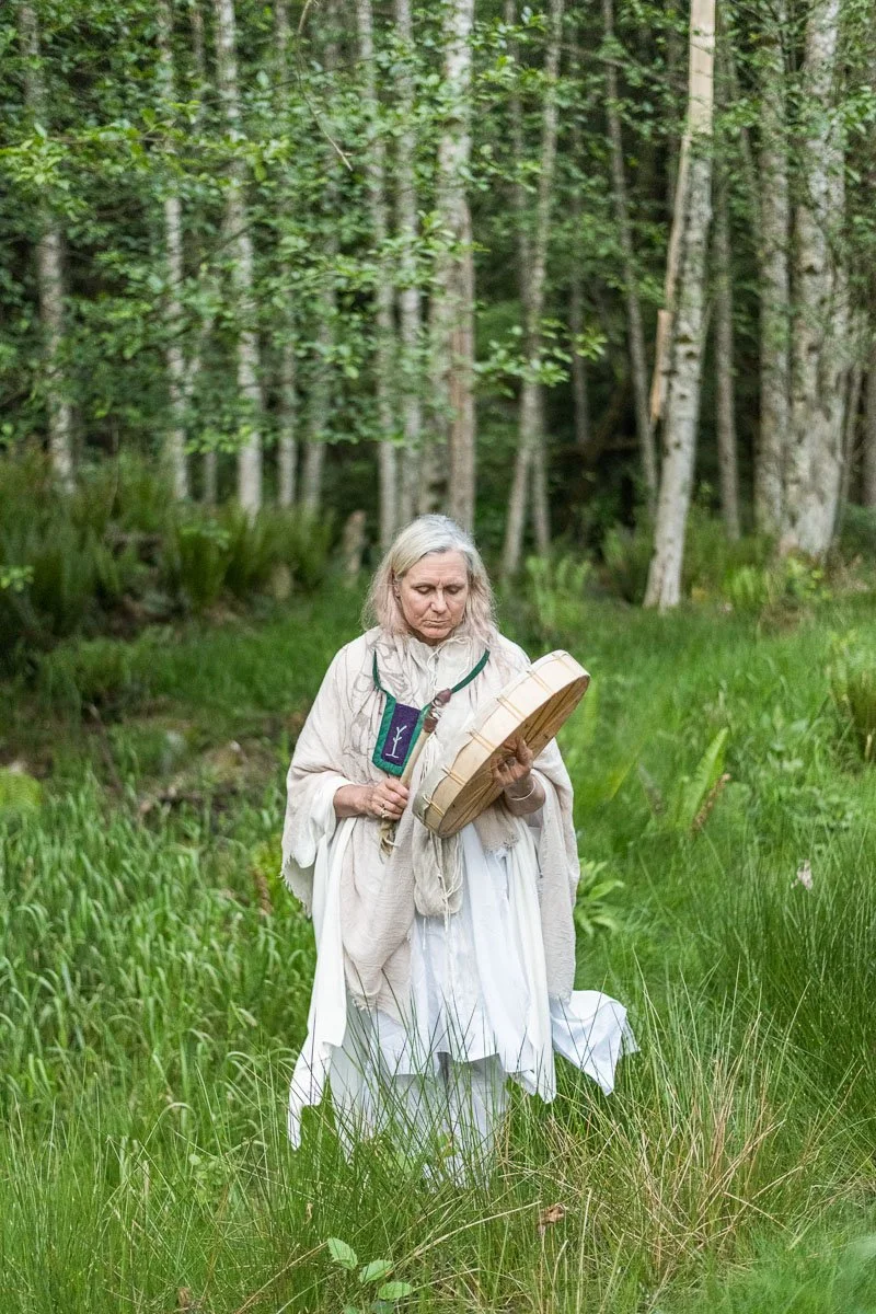 Woman in forest leading ceremony, spiritual retreat photography Nova Scotia