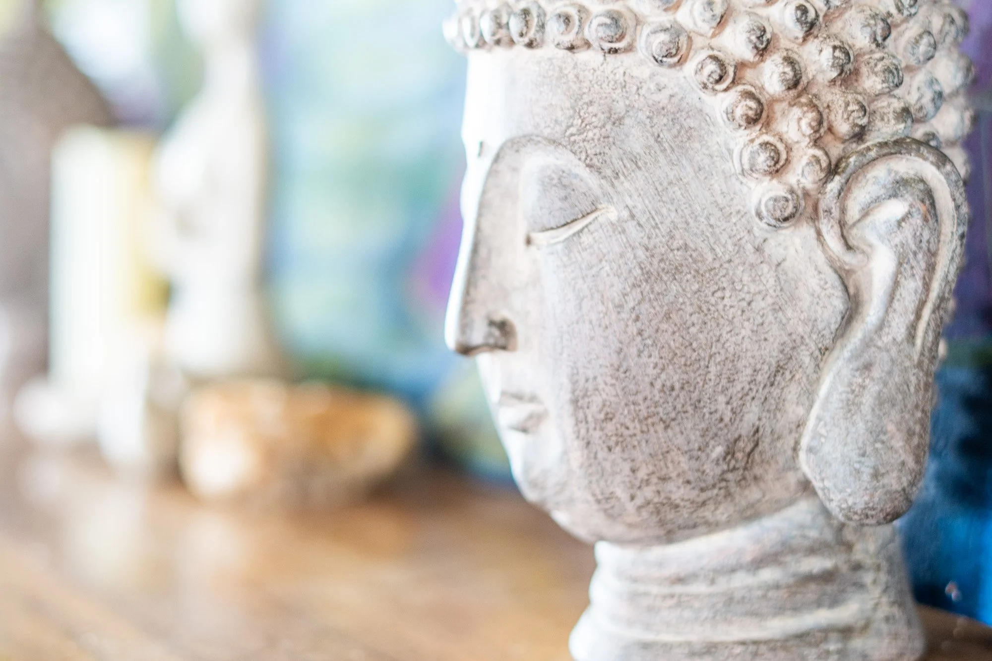 Buddha statue detail at wellness retreat, yoga retreat photographer