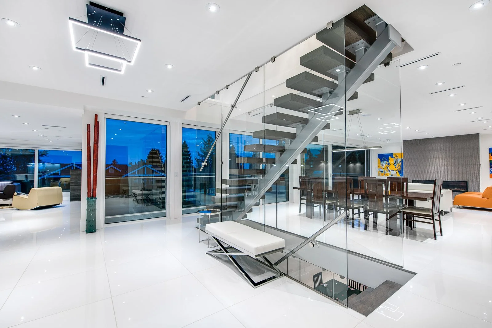 Bright stairwell with glass railing, real estate photography Vancouver