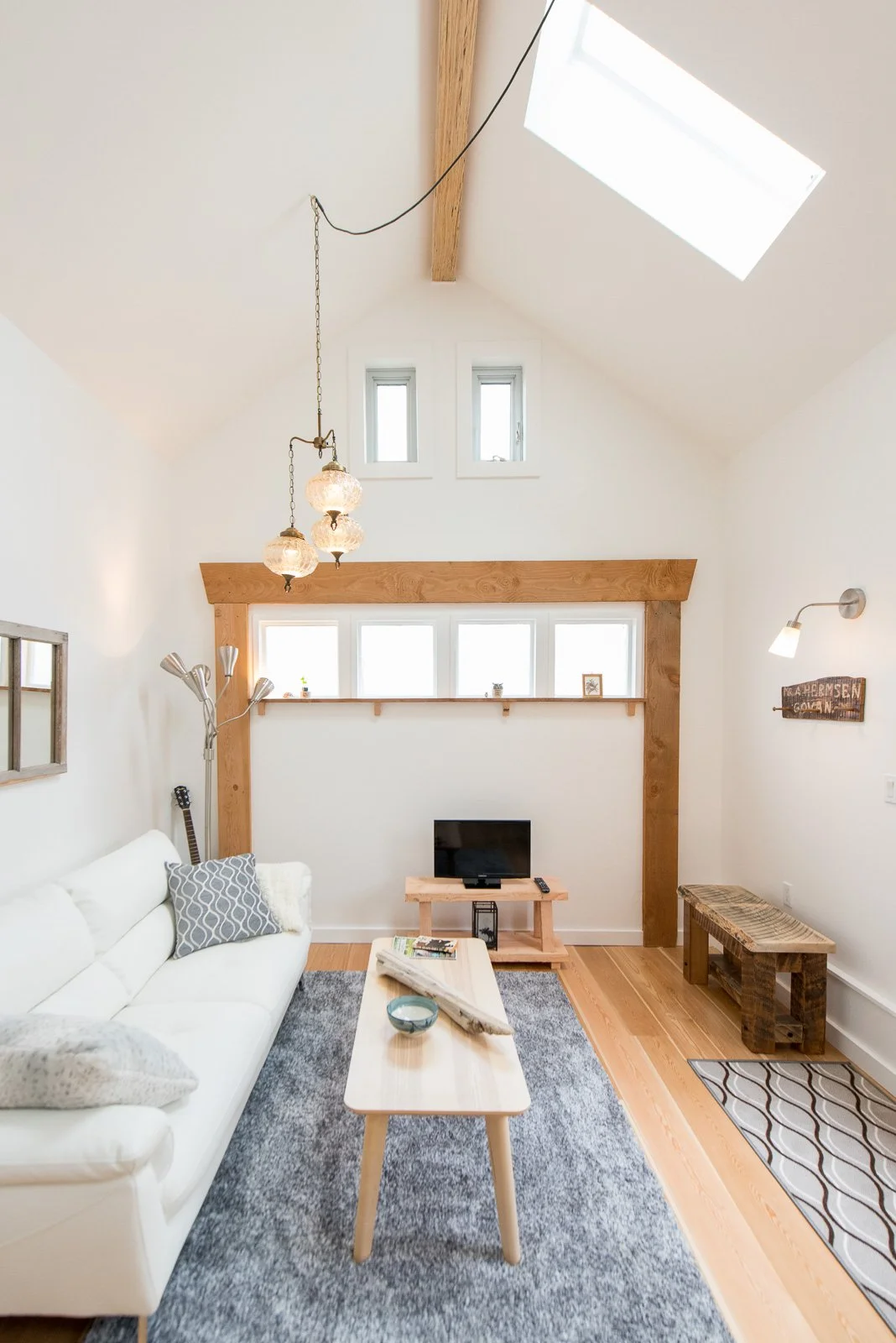 Bright modern living room with vaulted ceiling, architectural photographer South Shore
