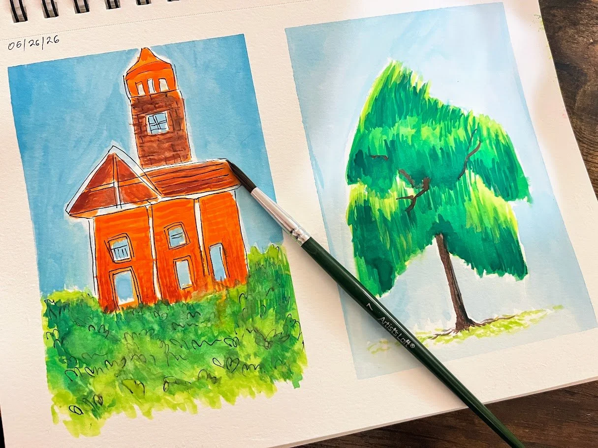 Handmade watercolor illustrations of a church and a tree on two separate sheets of paper. A black pen is placed on top of the church illustration.