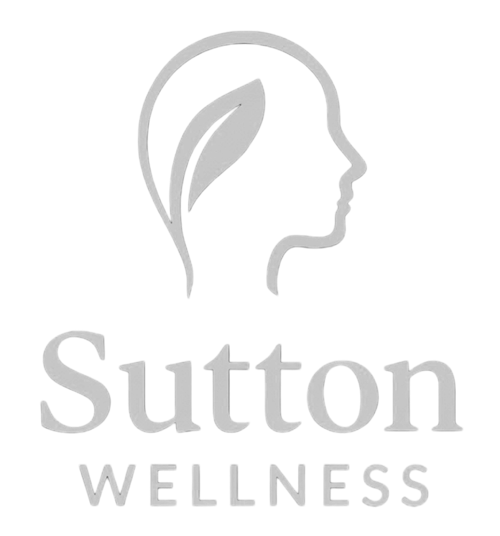 A logo for Sutton Wellness, featuring a side profile of a woman's face with a leaf inside her head, in gray on a black background.