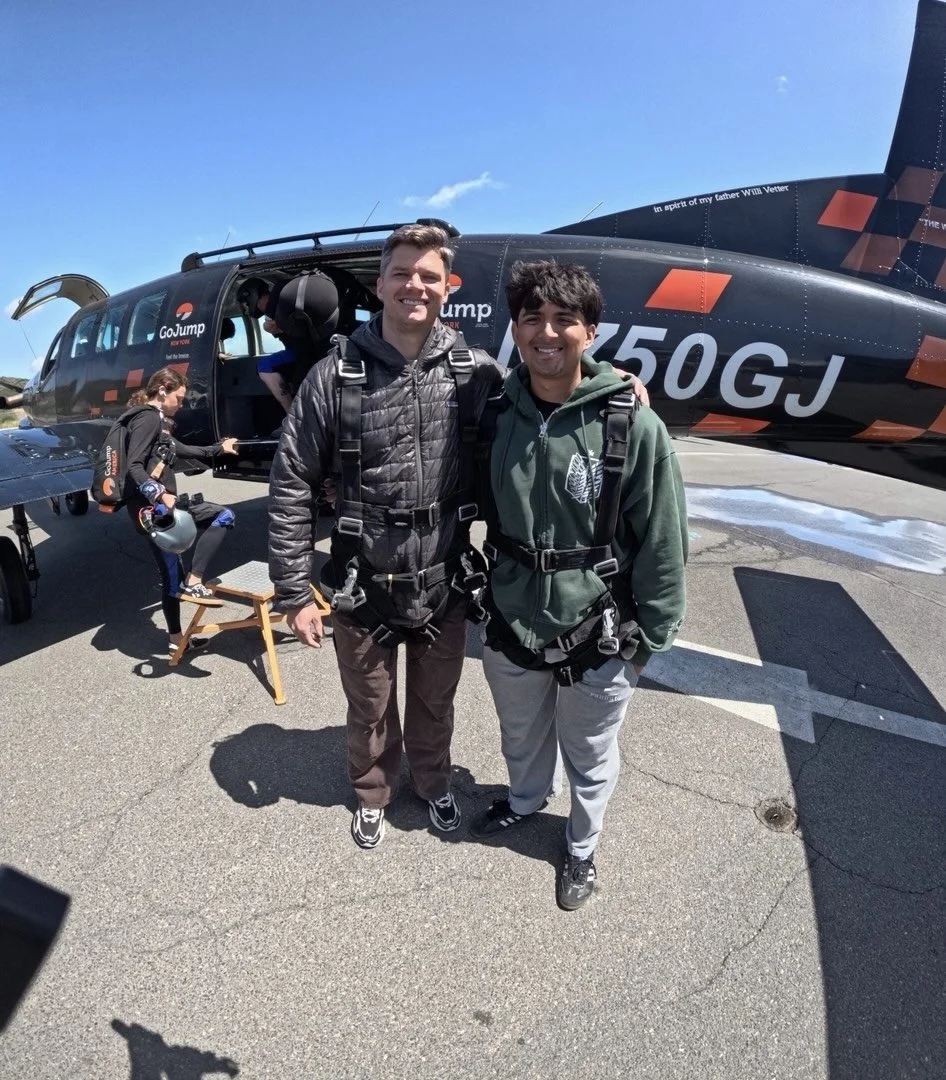 Forge founder and a young man preparing for a skydiving adventure.