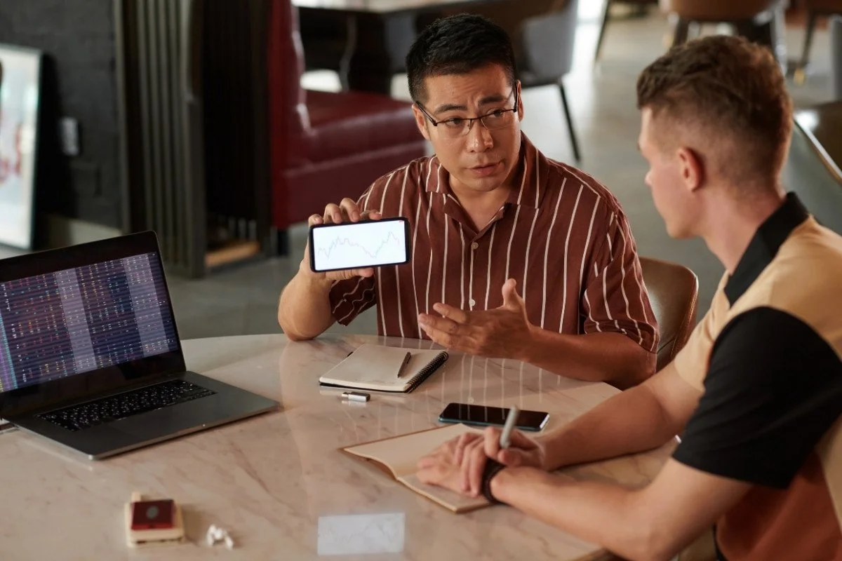Two mens making research about Chinese trade show event.