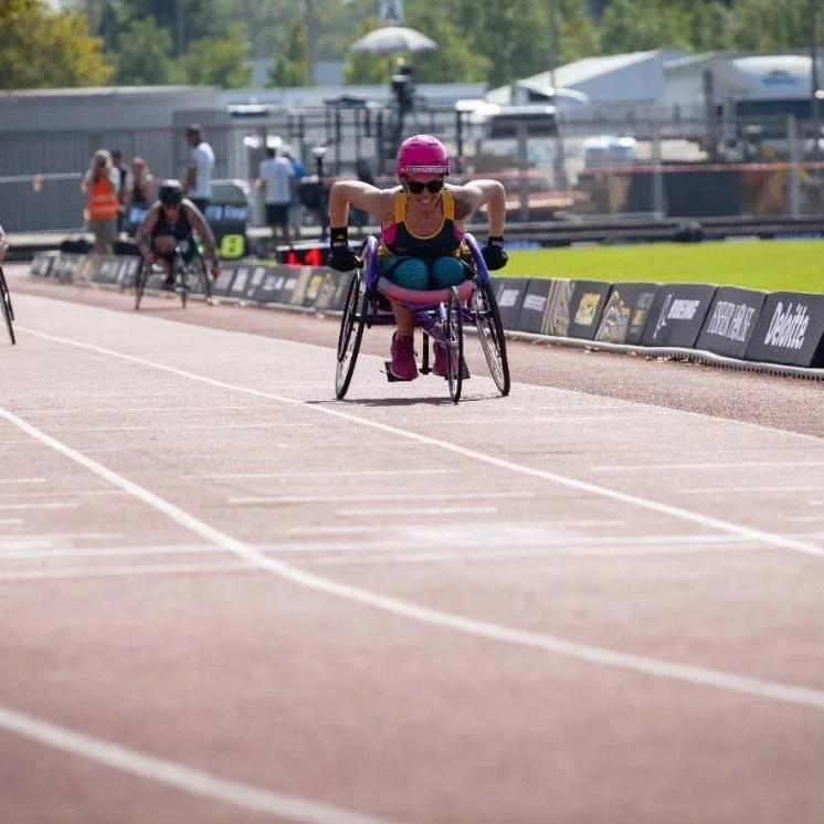 First female Aussie in chair and won gold baby.jpg