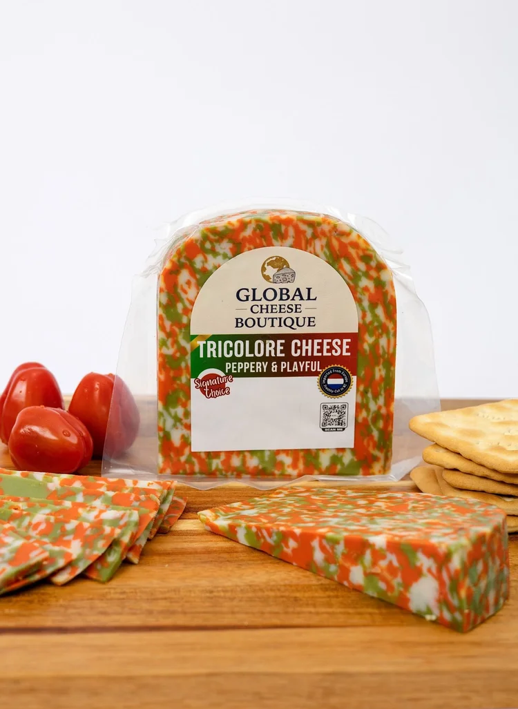 Tricolore cheese pack with a wedge and slices on a wooden board
