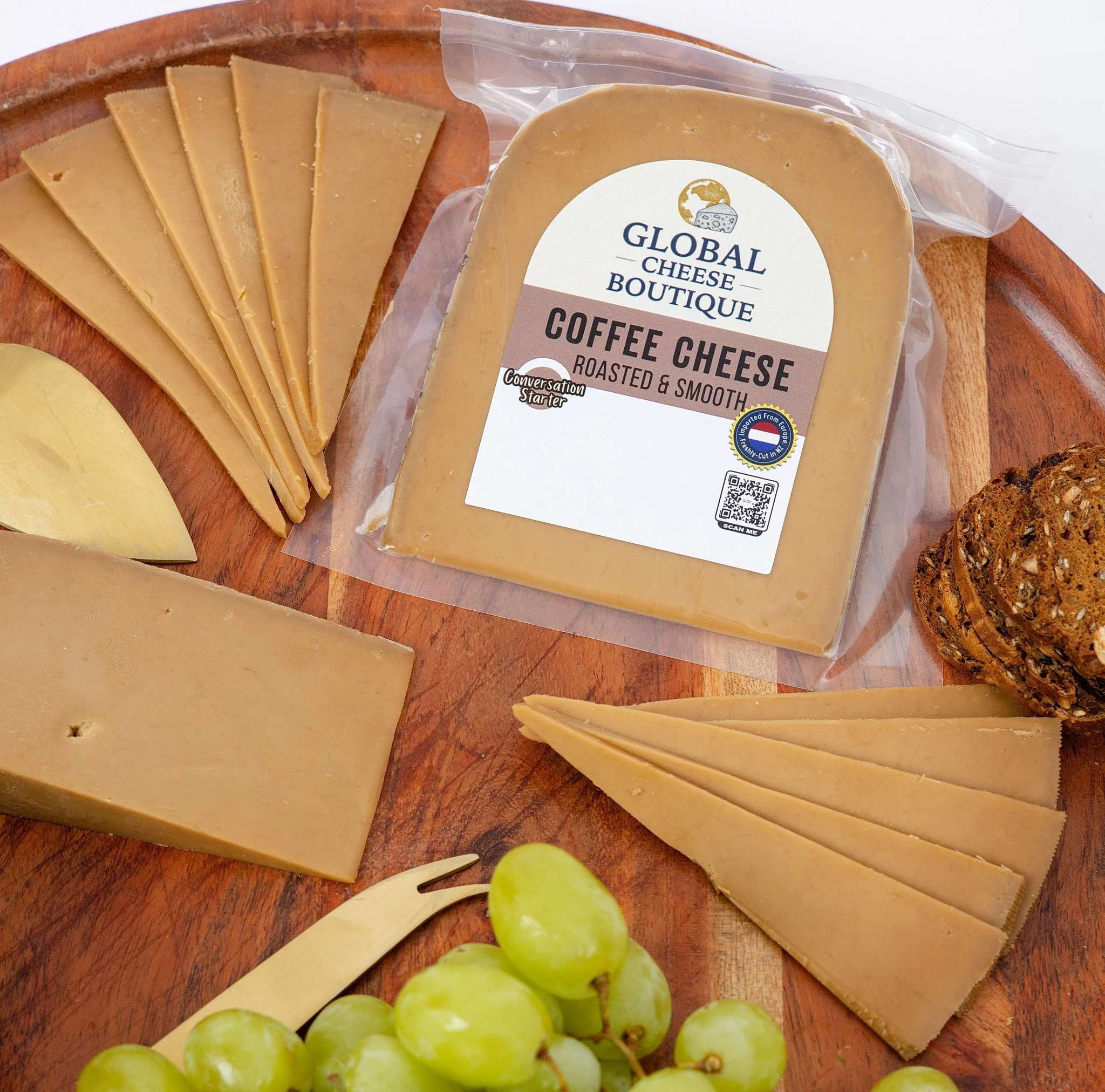 Dutch Coffee Gouda 170 g, sealed pack, wedge and slices on a round board