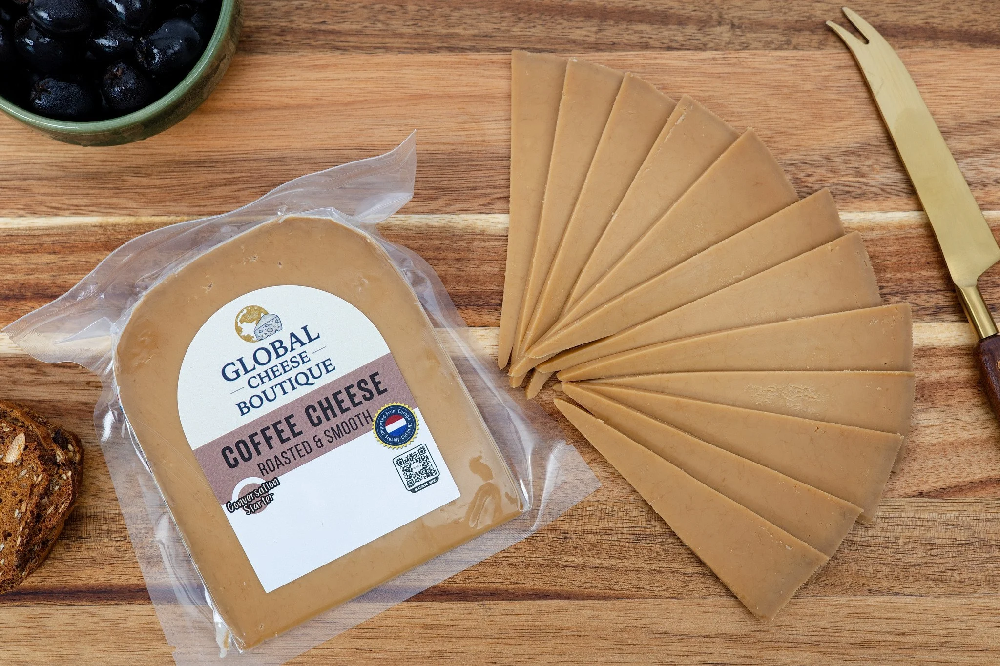 Dutch Coffee Gouda 170 g, sealed pack and fanned slices on a wooden board