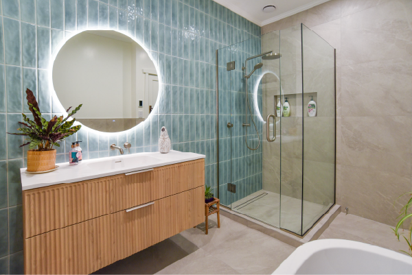 Modern home bathroom with a custom-made corner glass shower.