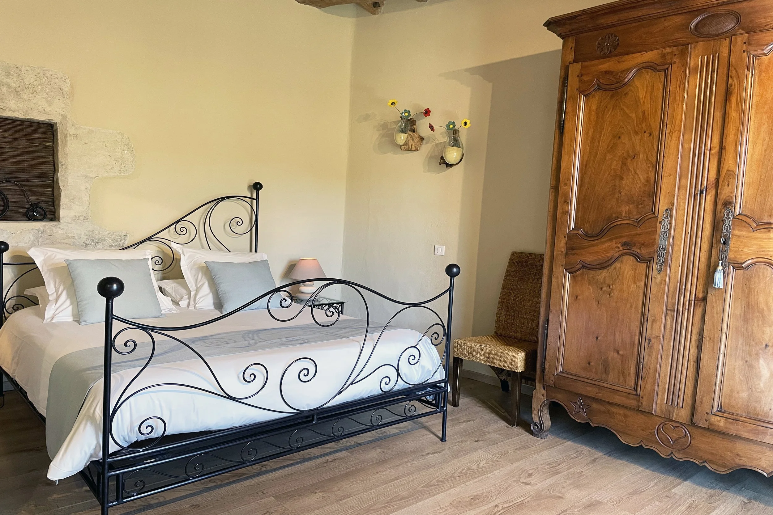 Bedroom for two with antique Louis XV wardrobe in Provence