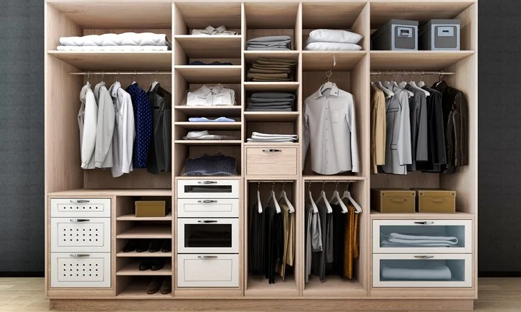 Organized wooden wardrobe with hanging shirts and suits, folded clothes, boxes, drawers, and shelves.
