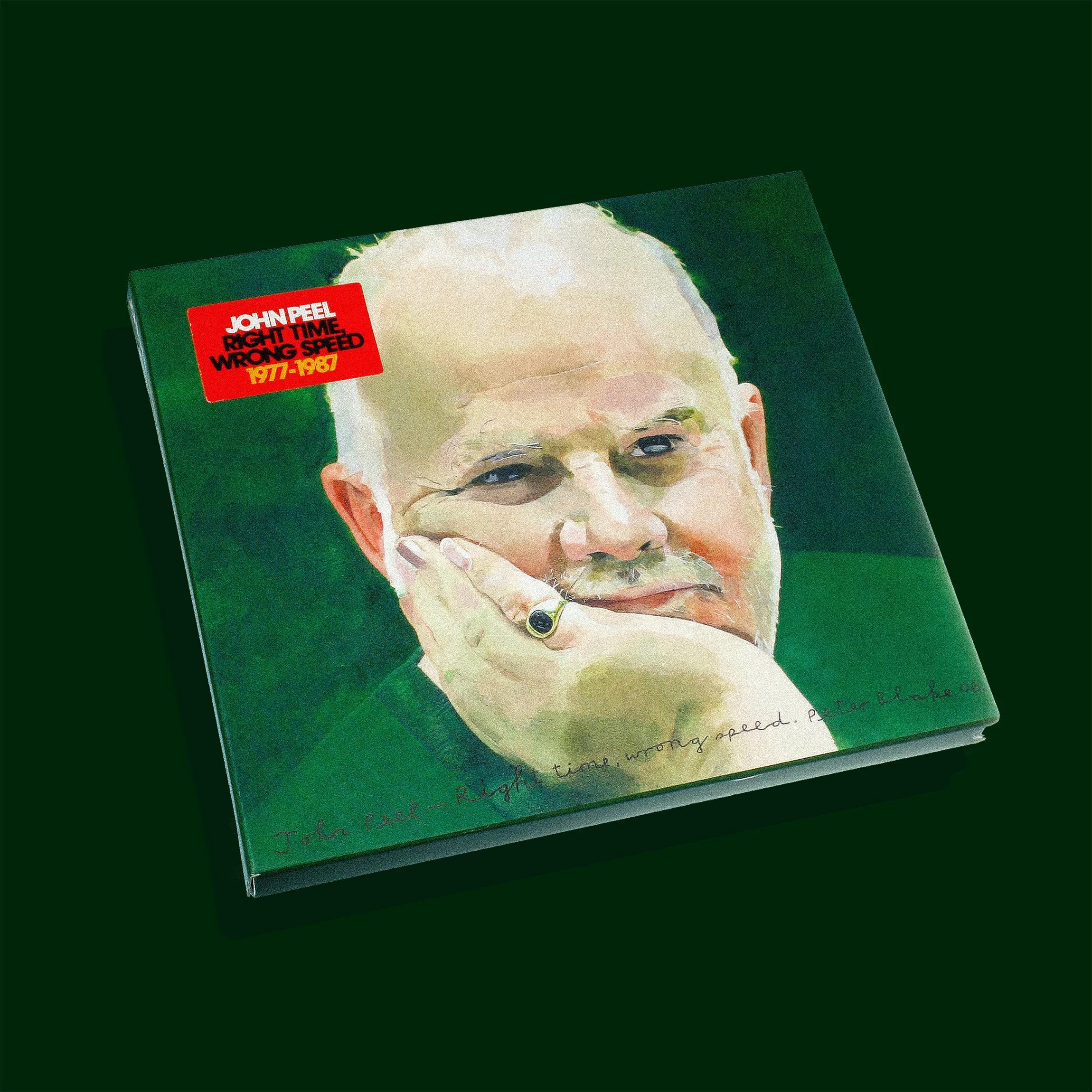 A book with a portrait of an older man with glasses and a white beard, holding his chin with his hand, set against a green background.