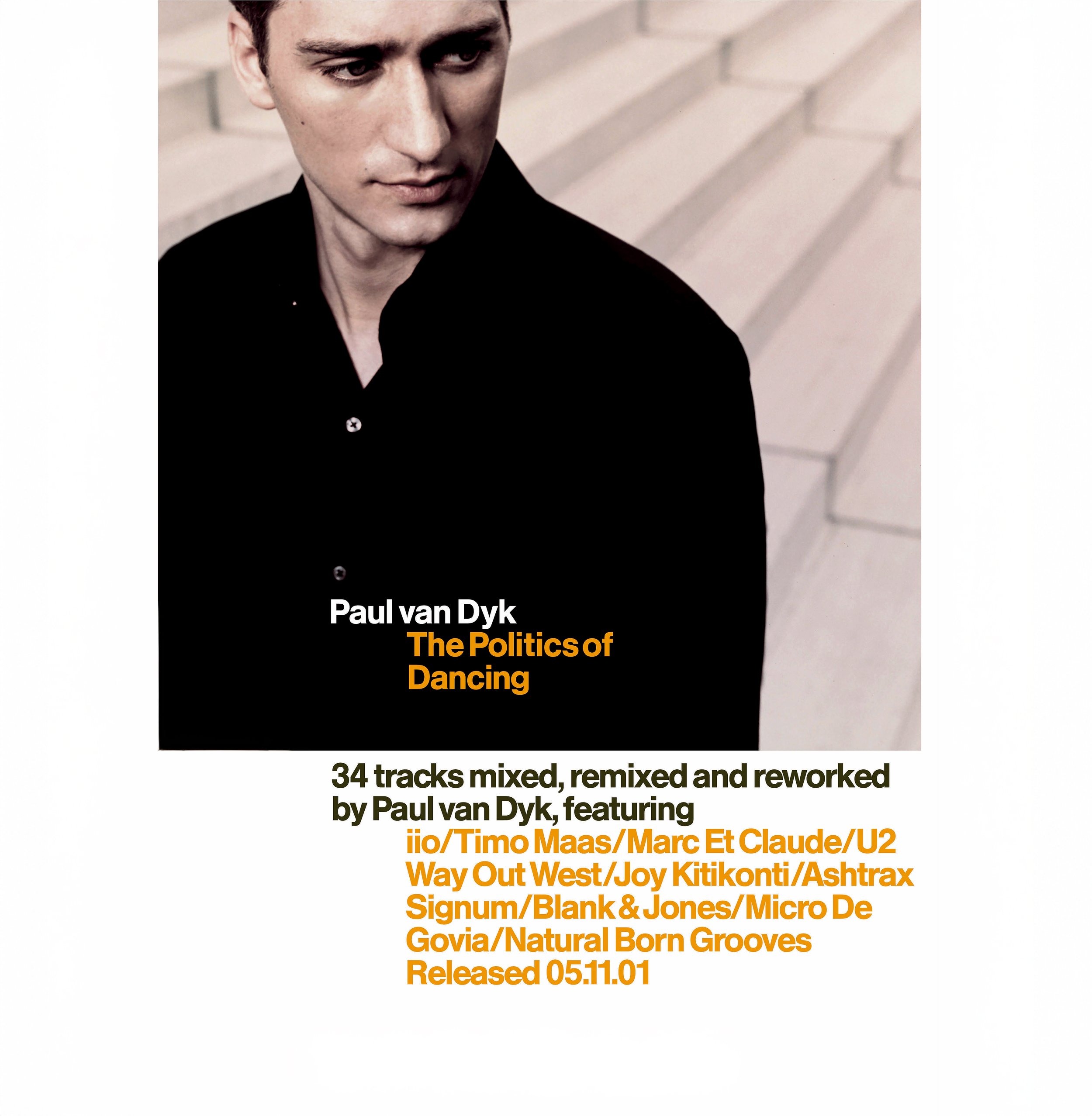 Cover of a music album by Paul van Dyk titled "The Politics of Dancing", featuring a close-up photo of a young man with short dark hair, wearing a black shirt, looking away. The album contains 34 tracks mixed, remixed, and reworked by various artists.