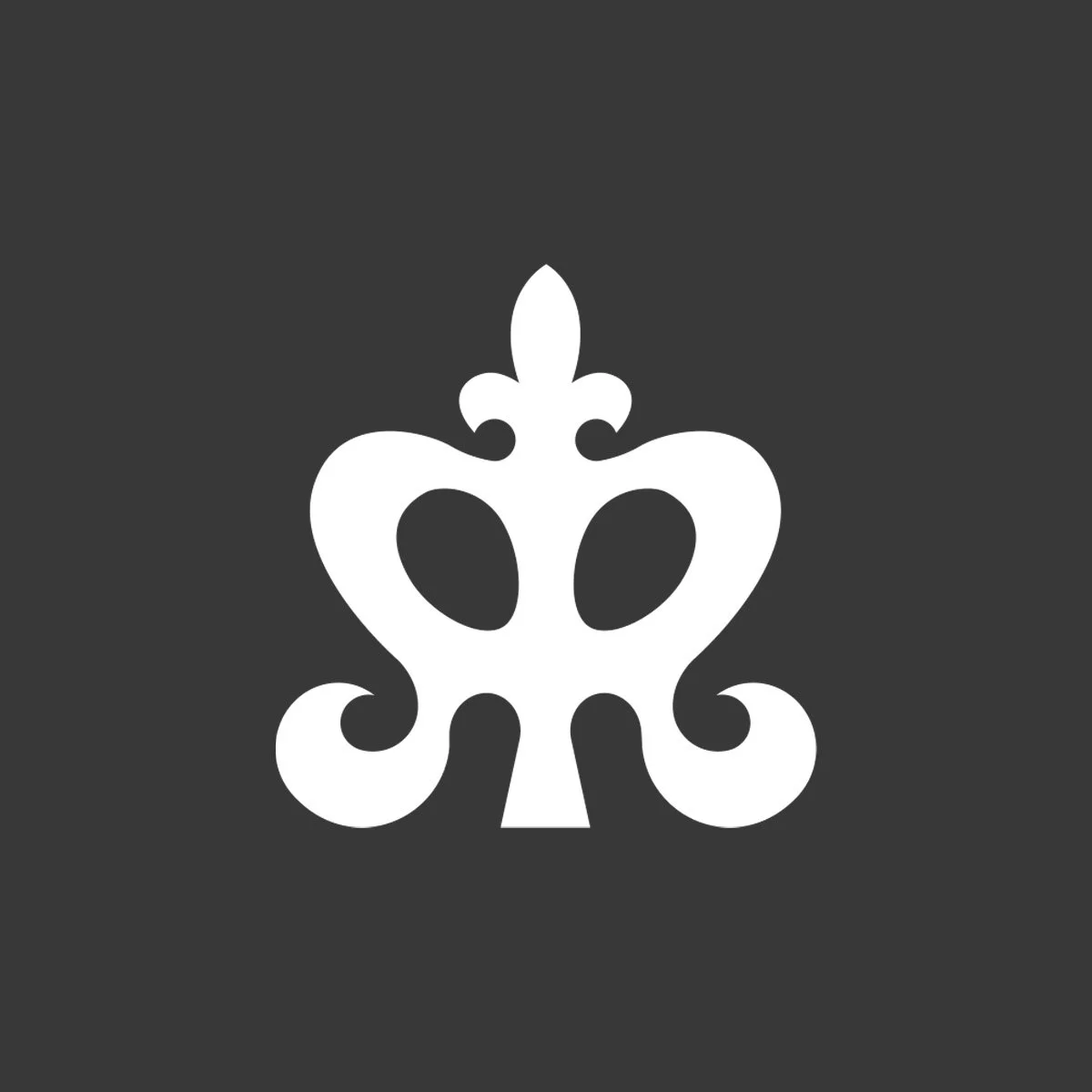 White decorative ornament on a dark gray background.