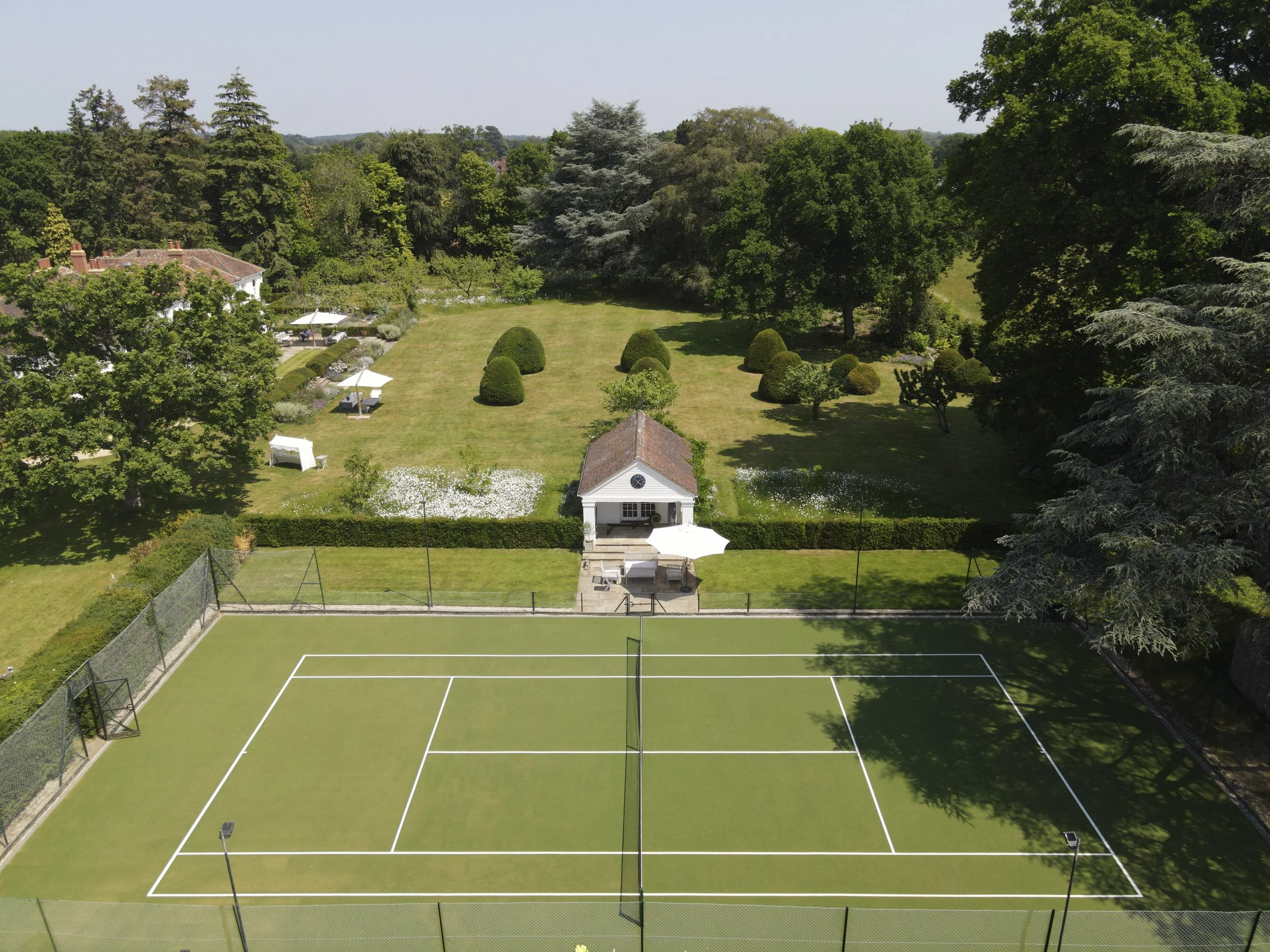 Tennis court and gardens from air.jpg