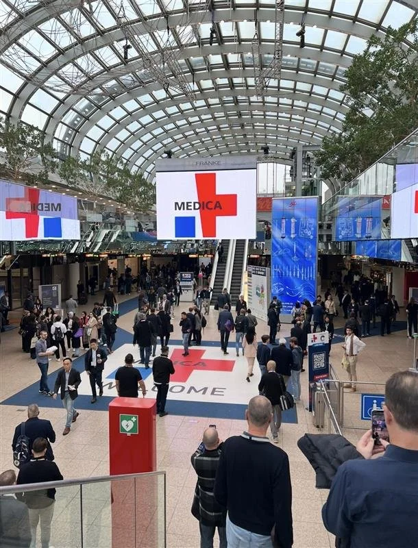 People busy walking at the Medica tradeshow in Cologne, Germany