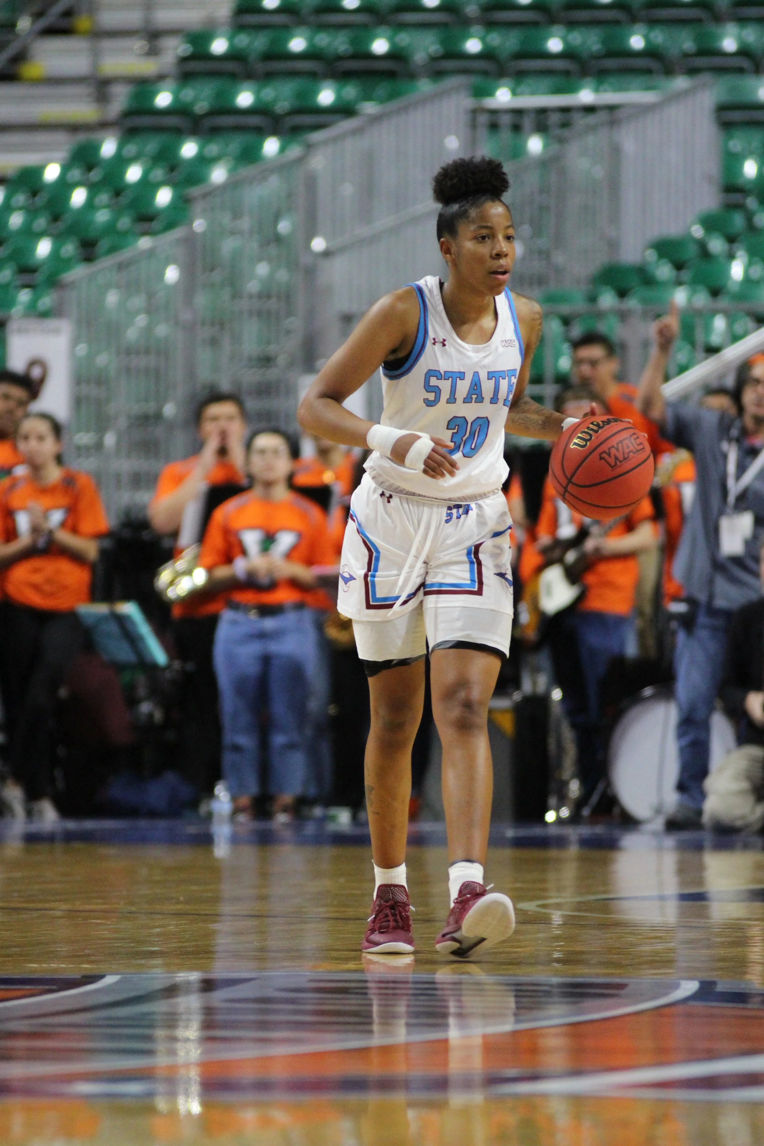 Aggie junior guard Gia Pack eyes coach Brooke Atkinson in the 2019 Western Athletic Conference women's championship against UT Rio Grande Valley on Saturday March 16, 2019 in the Orleans Arena. (Photo by Eli Whitney/Kokopelli)