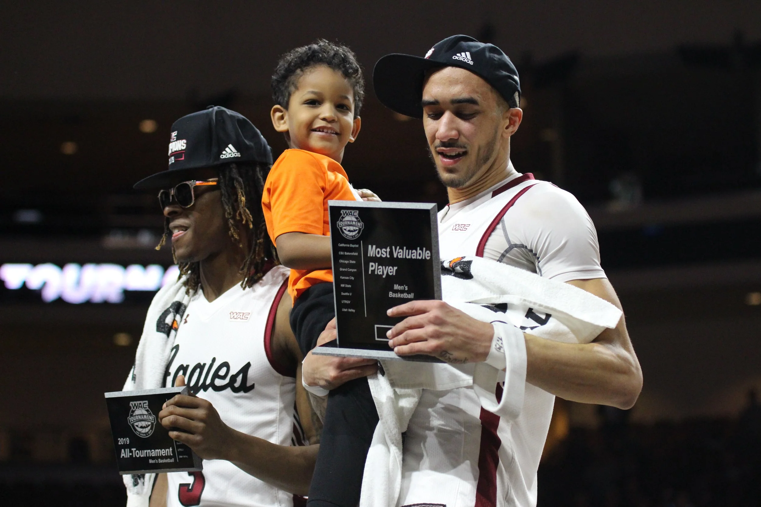 Aggies Terrell Brown, left, and Trevelin Queen hold their WAC Tournament honors after winning the 2019 Western Athletic Conference Tournament championship over Grand Canyon, Saturday, March 16, 2019, at Orleans Arena in Las Vegas. (Photo by Eli K. Wh
