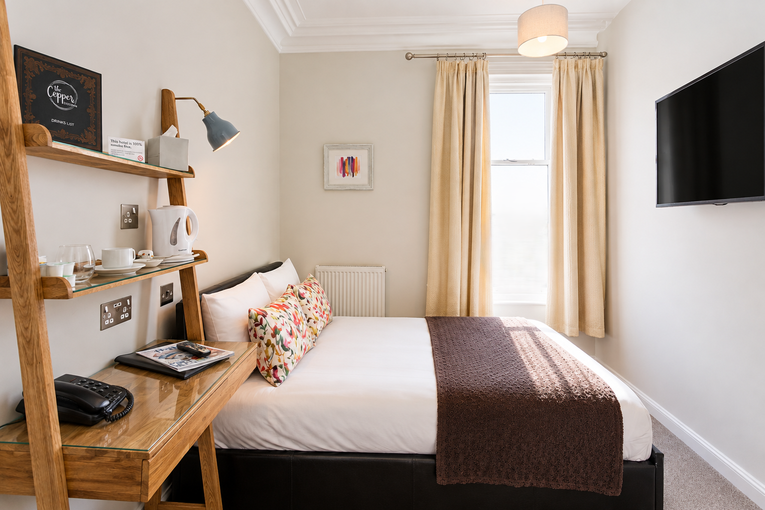 Single room at Andover House Hotel in Great Yarmouth with comfortable small double bed and desk
