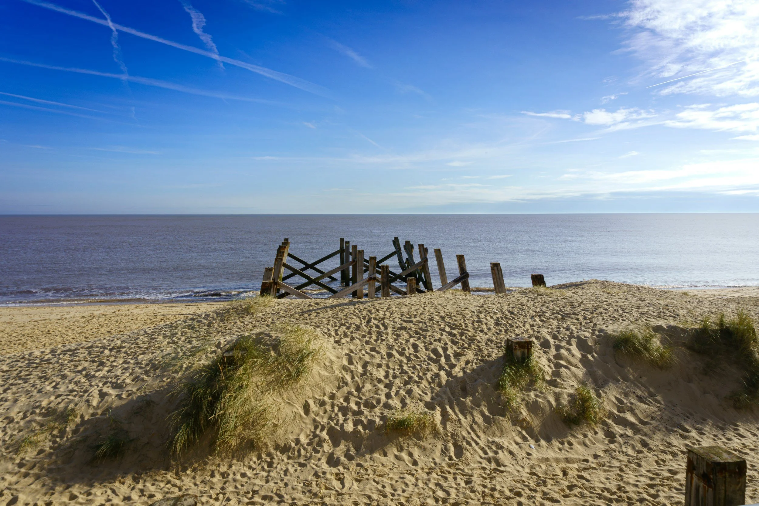 Wooden structure surrounded by sand and sea on the Great Yarmouth Beach