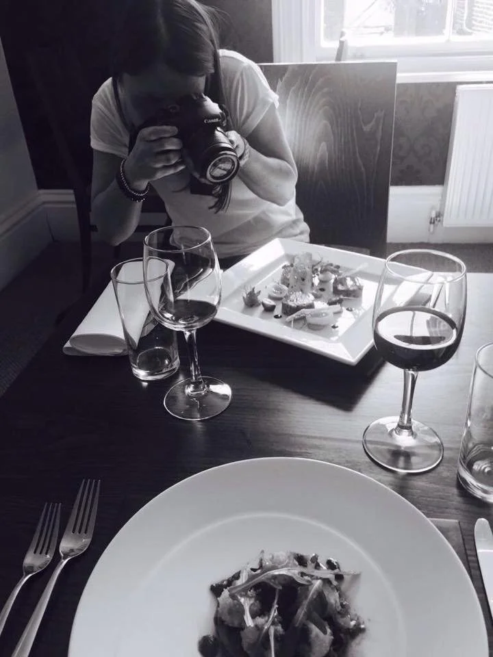 Hotel owner photographing food for marketing at a hotel restaurant in Great Yarmouth