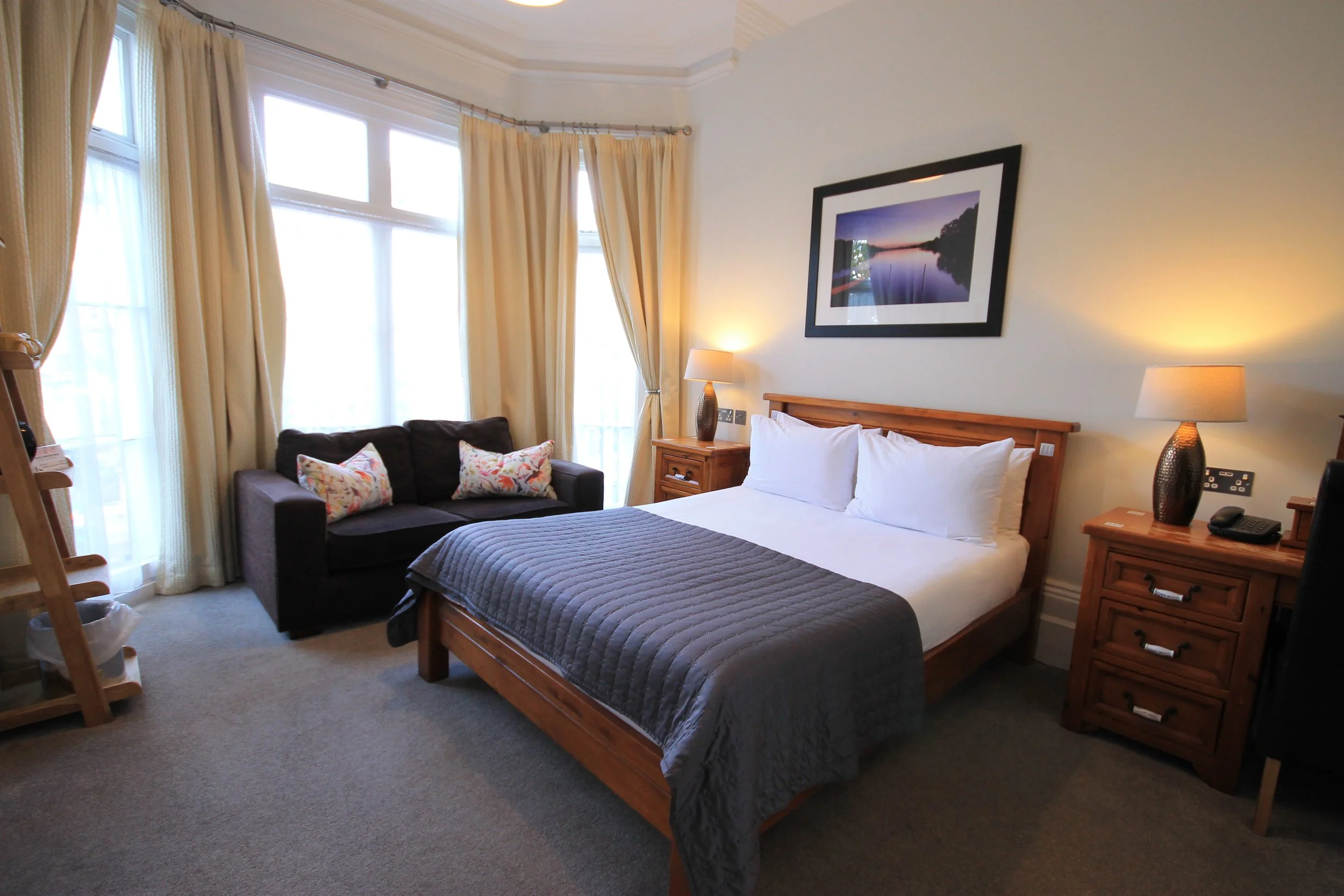 Bay Window room at Andover House Hotel in Great Yarmouth with sunlight streaming through and comfortable seating