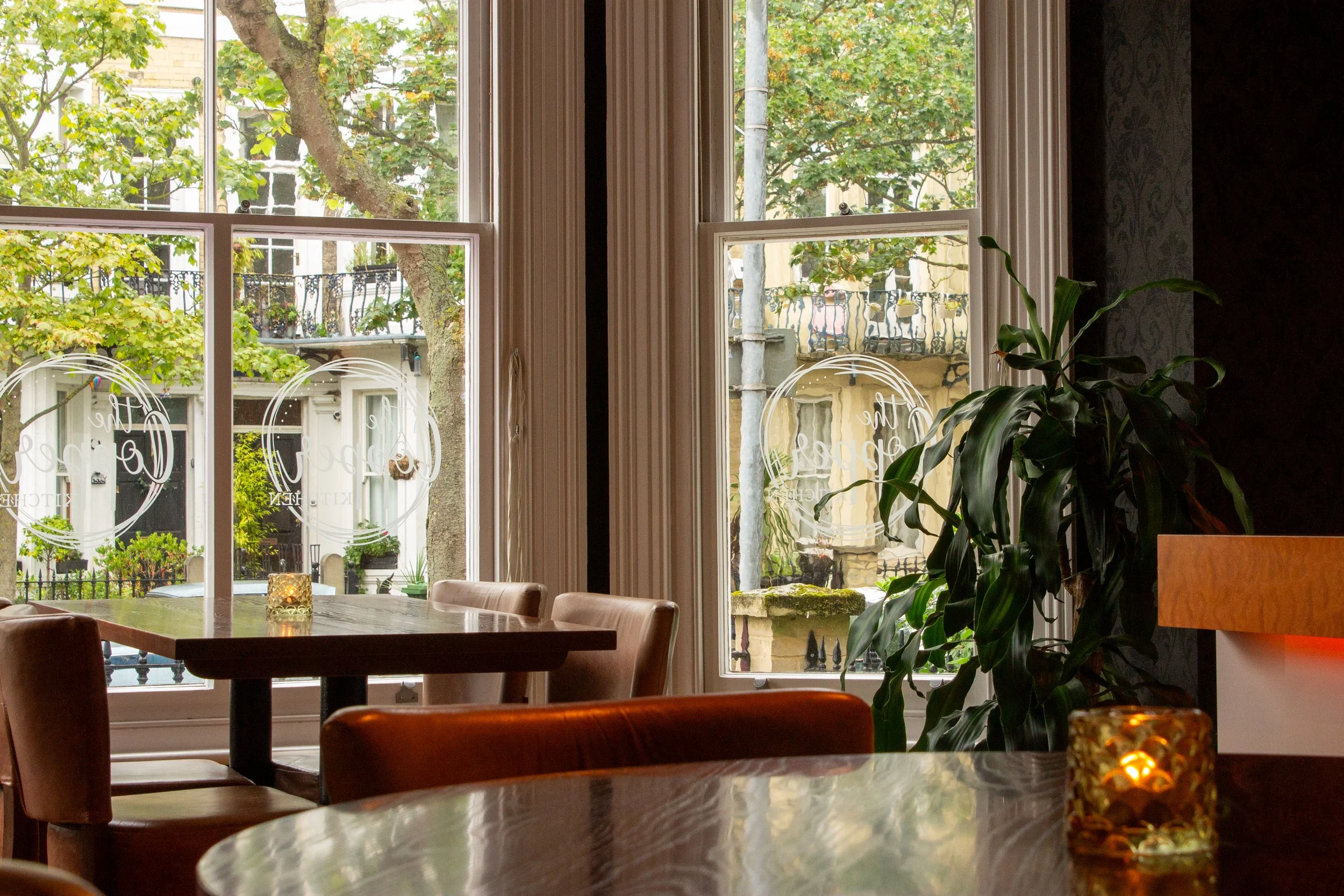 Guests can enjoy window seating at Andover House restaurant, adults-only hotel