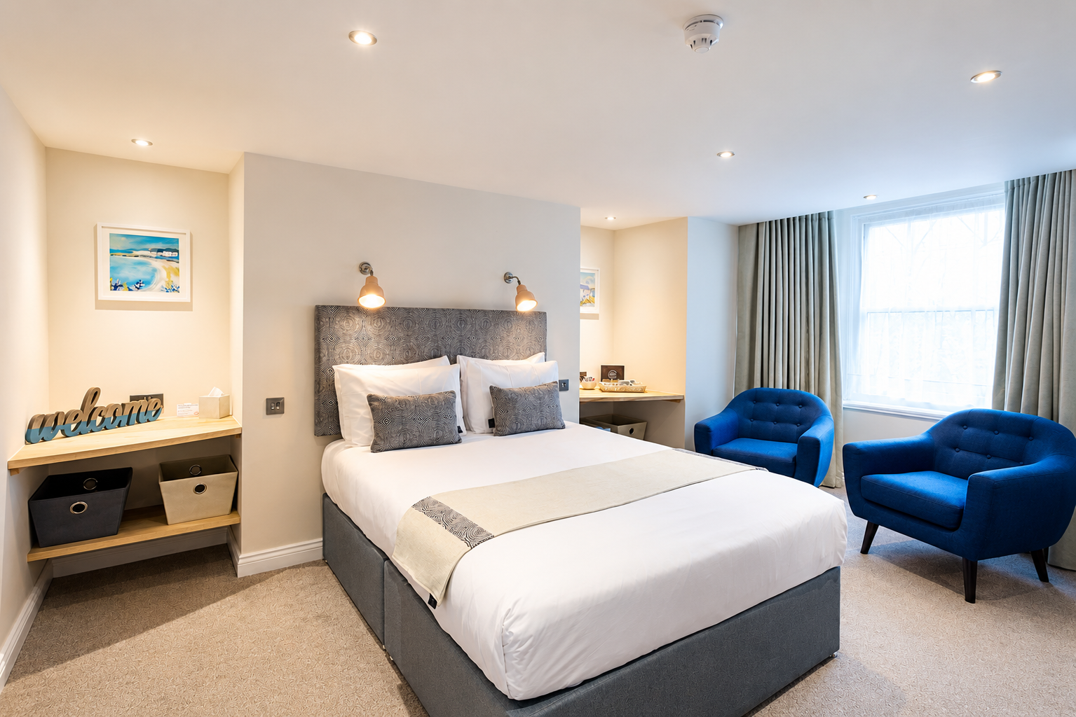Superior hotel room at Andover House in Great Yarmouth with work desk, seating and ambient lighting