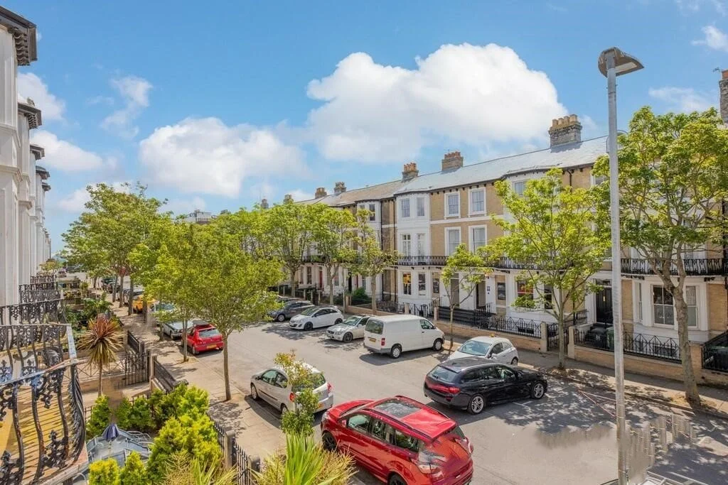 Exterior of Andover House Hotel in Great Yarmouth on a tree lined avenue and street parking