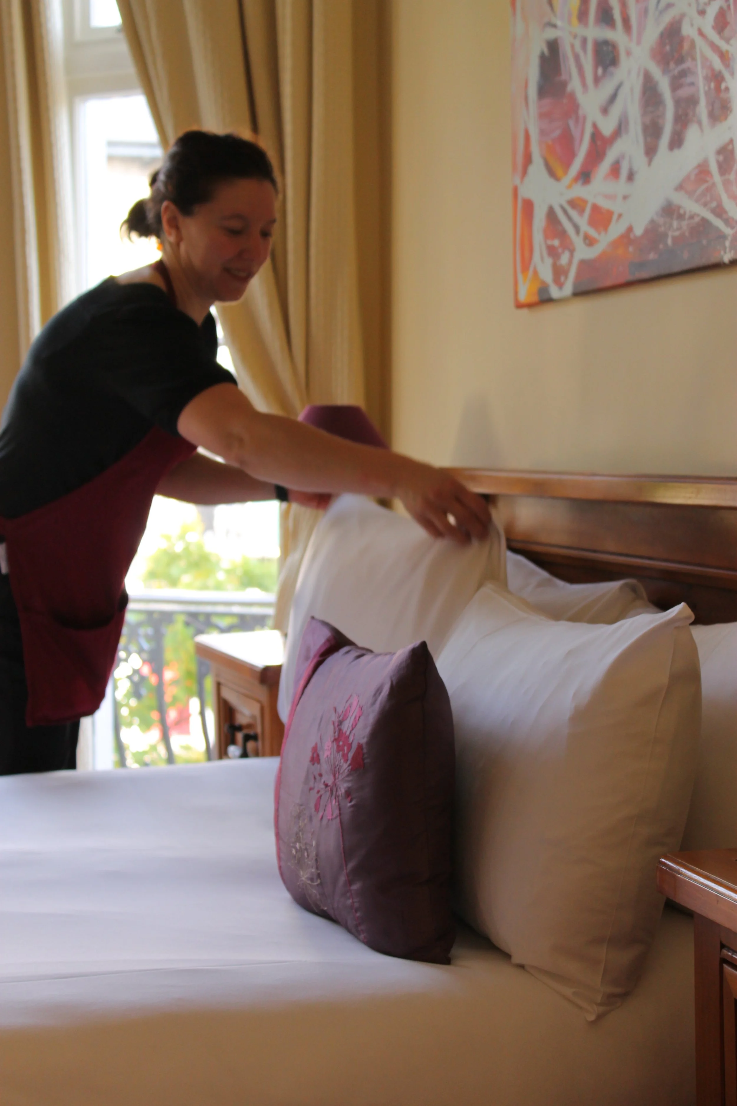 Housekeeping tidying hotel bedrooms at Andover House Hotel in Great Yarmouth