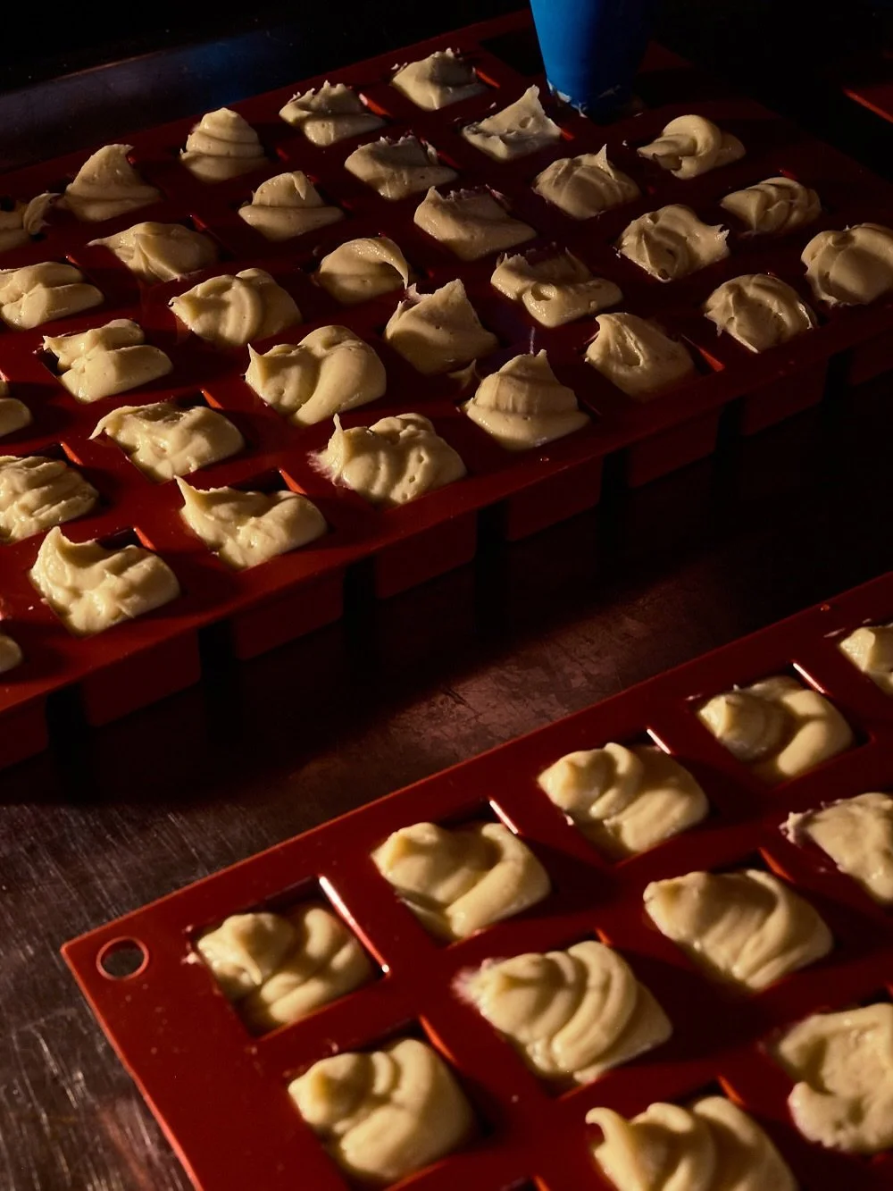 Piping panade into our custom trays is a balance between speed and finesse. Inaccuracies need to be corrected, so you don&rsquo;t want to overfill! 

#pastries #pipingtechniques 

Served from our pop-up bakery on Kingsland Road - our Little Bumps are