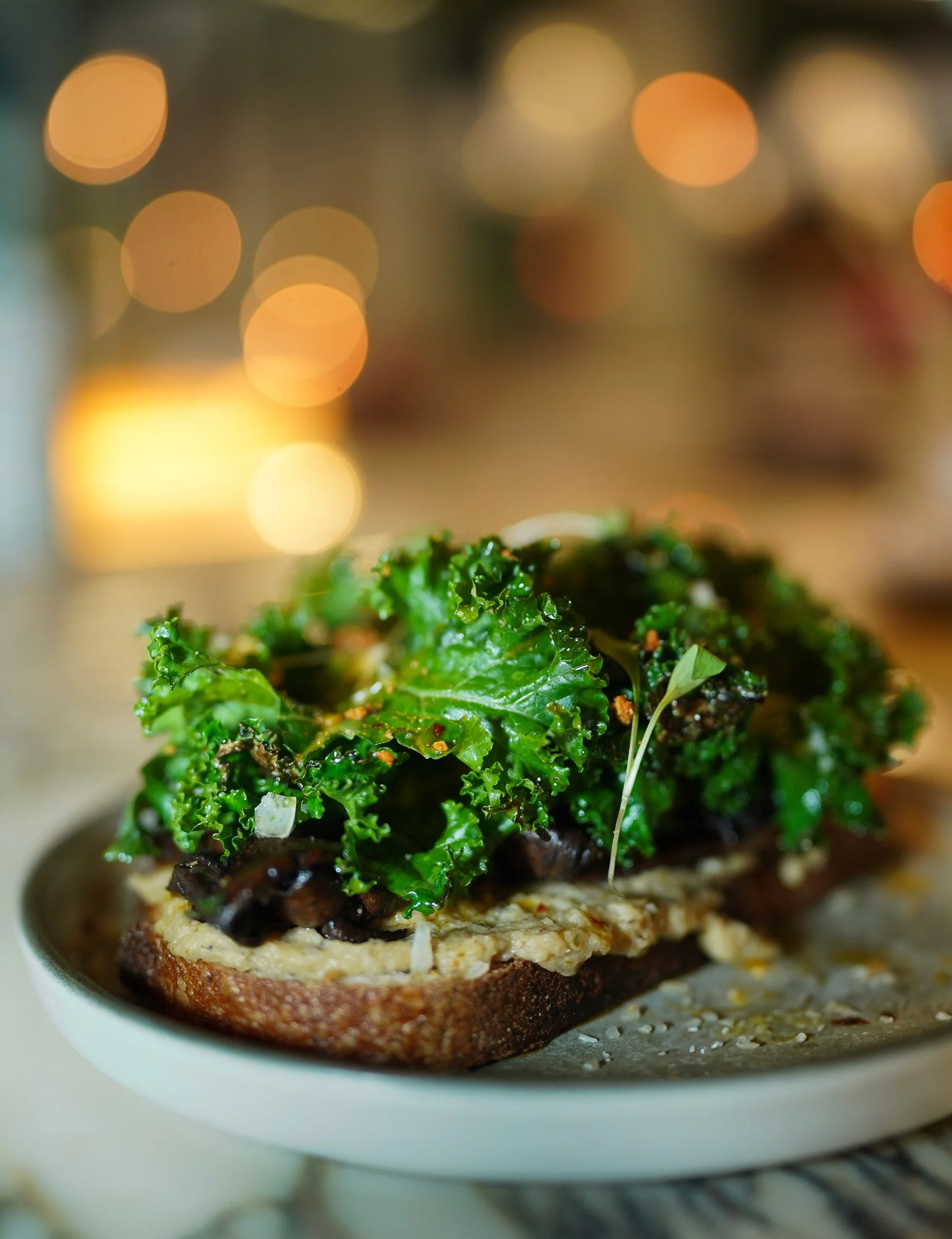Fresh kale and greens on artisan bread in Dublin restaurant.