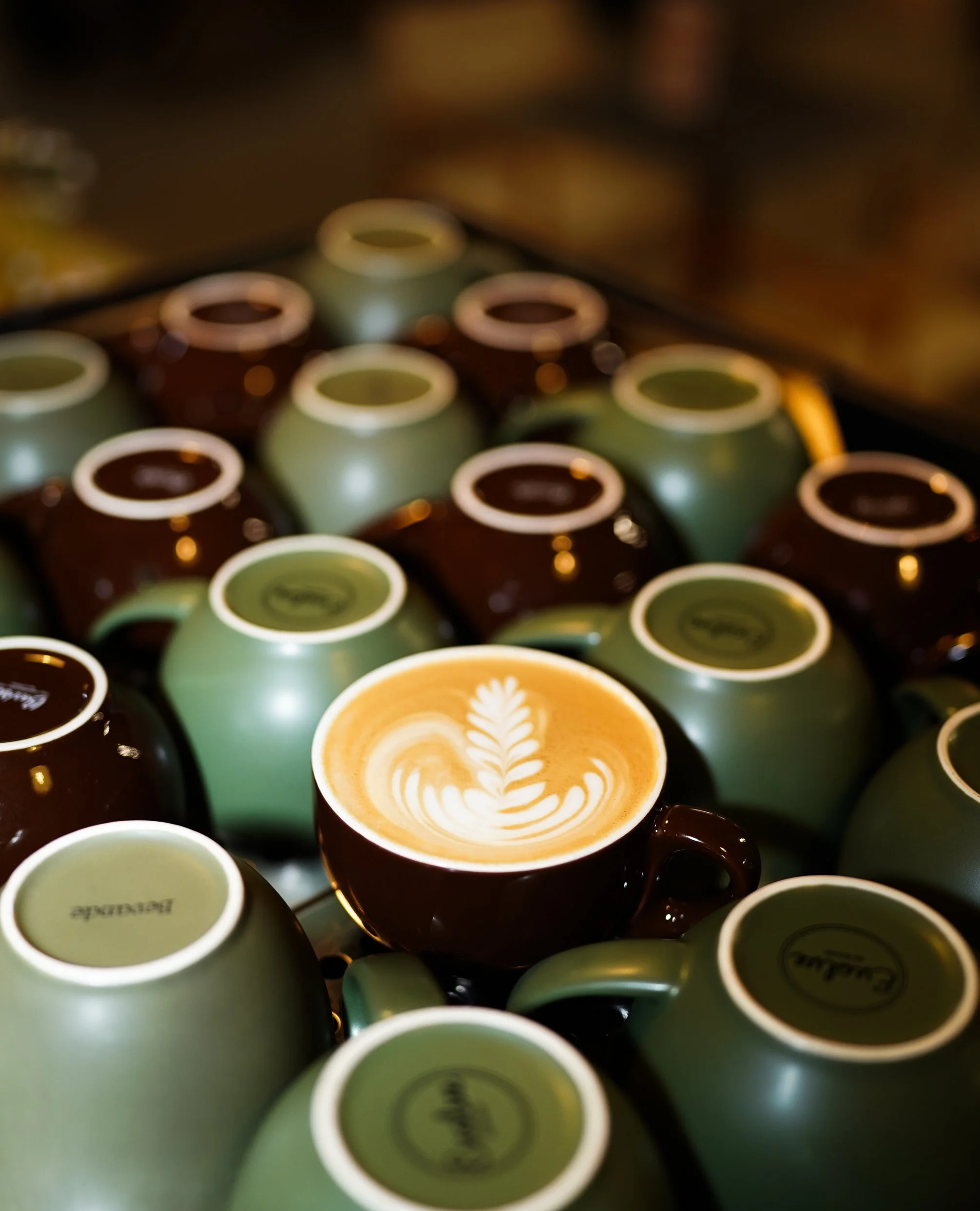 Top view of latte art and coffee cups in a restaurant, professional café photography.