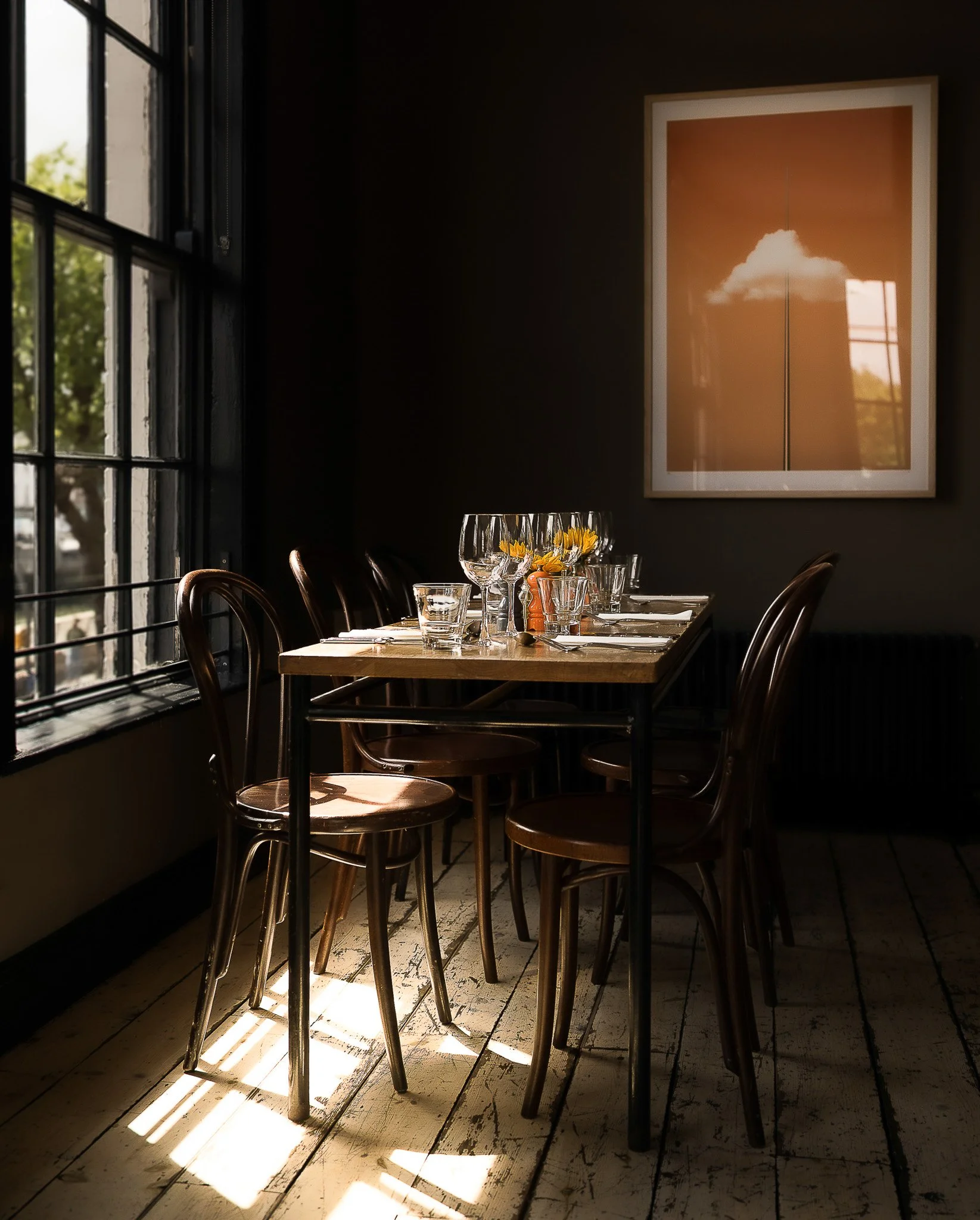 Elegant restaurant table setup by the window in Dublin café.