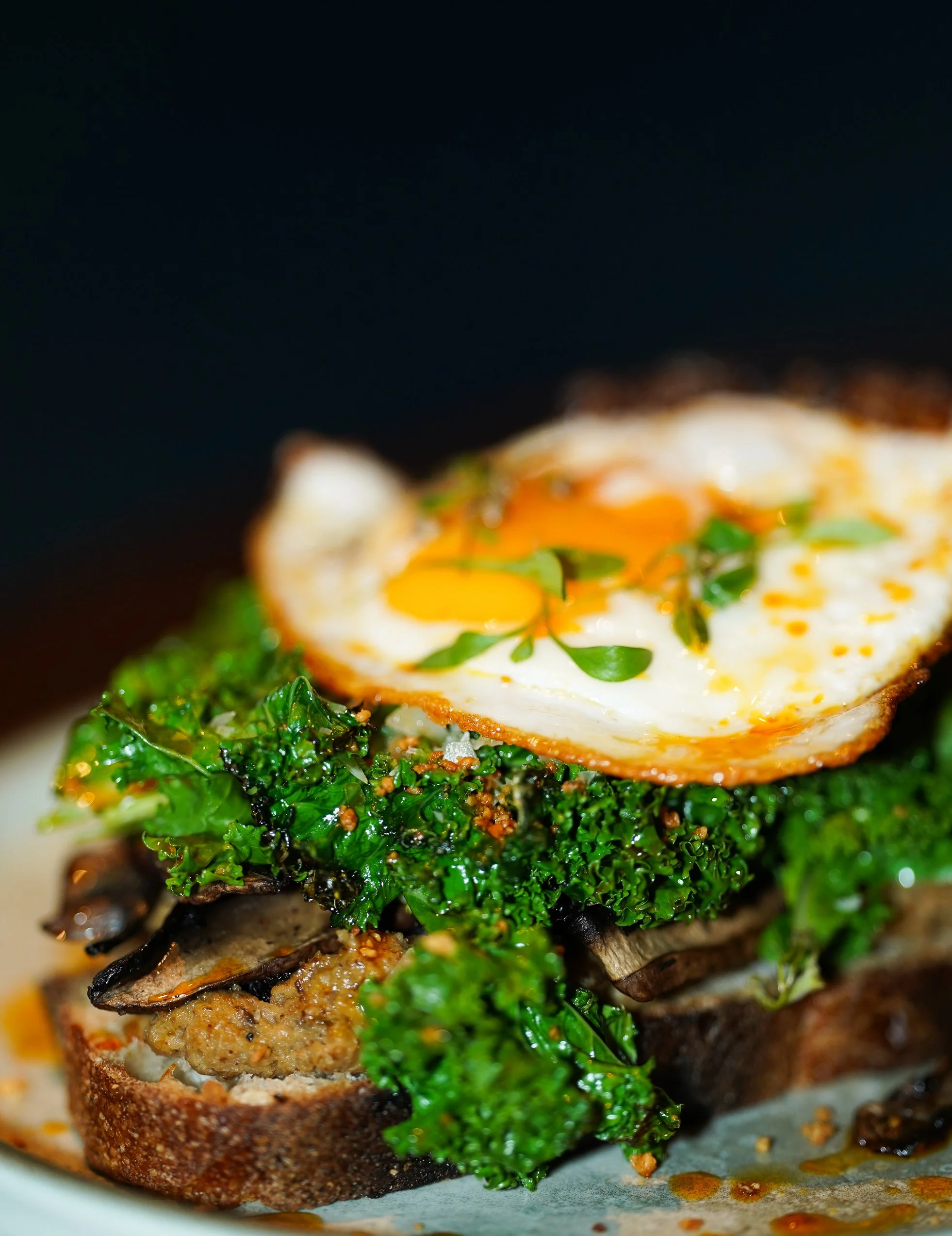 Avocado toast with kale, mushrooms and fried egg, Dublin café.