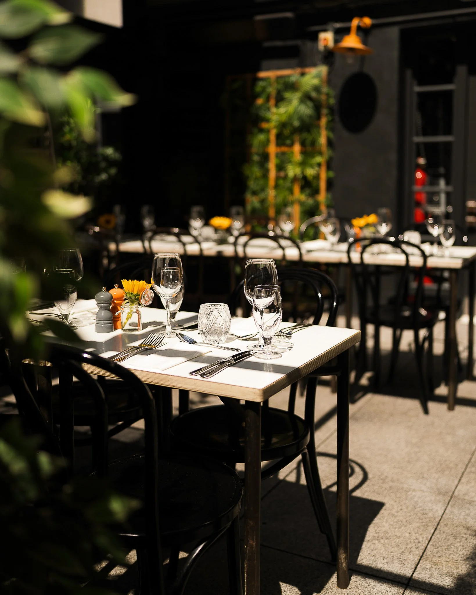 Outdoor restaurant terrace with elegant table setup in Dublin.