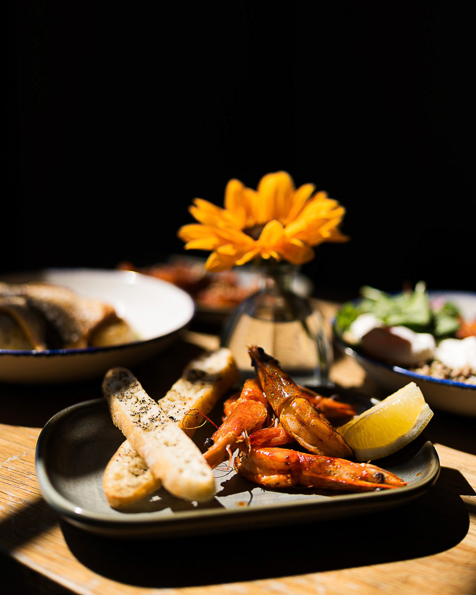 Gourmet seafood platter with bread and lemon in Dublin restaurant.