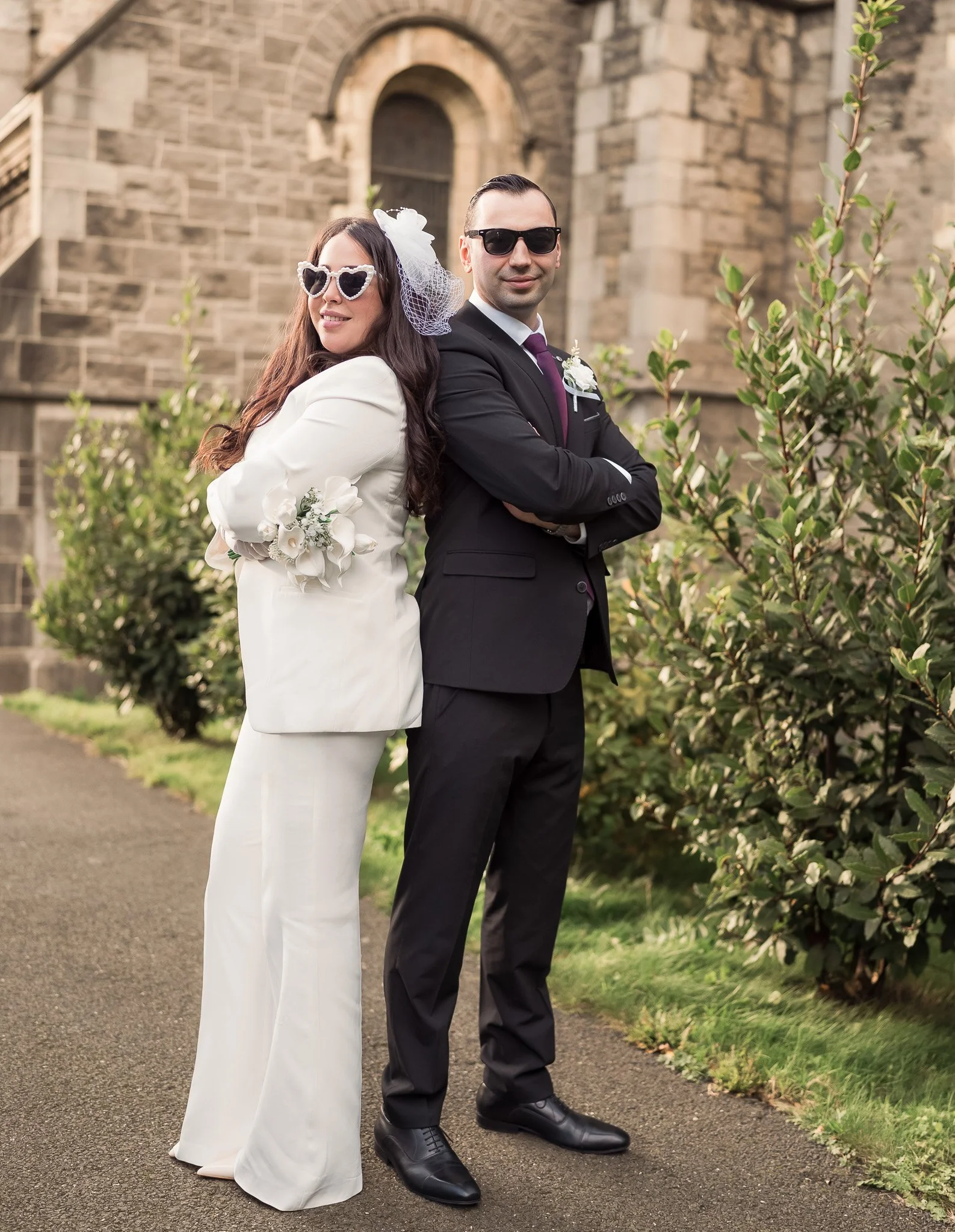 Playful wedding portrait of the couple posing confidently in Dublin.