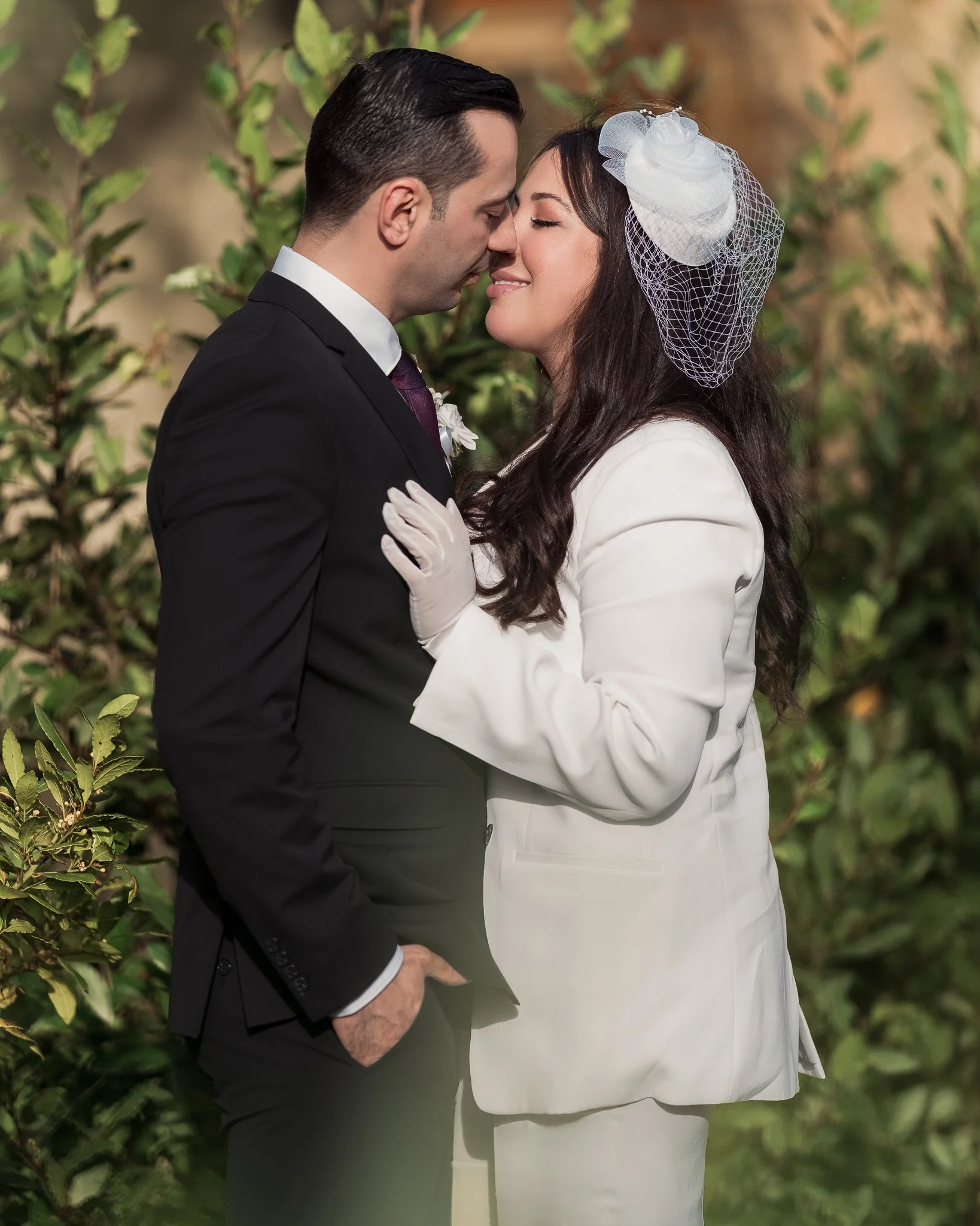 Intimate wedding kiss captured in warm golden light — romantic Dublin elopement moment.

