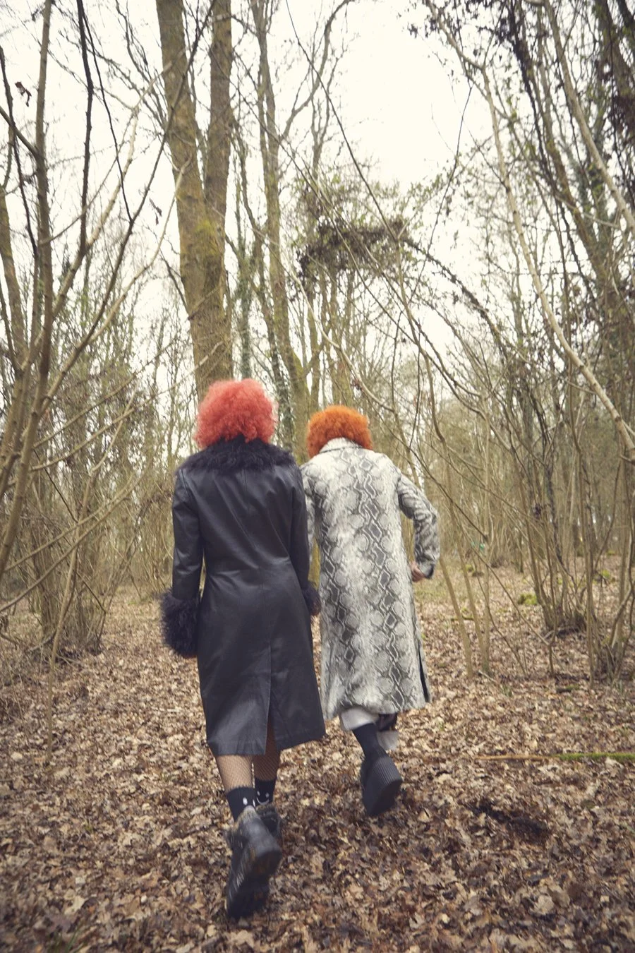 portrait of sisters walking away from camera