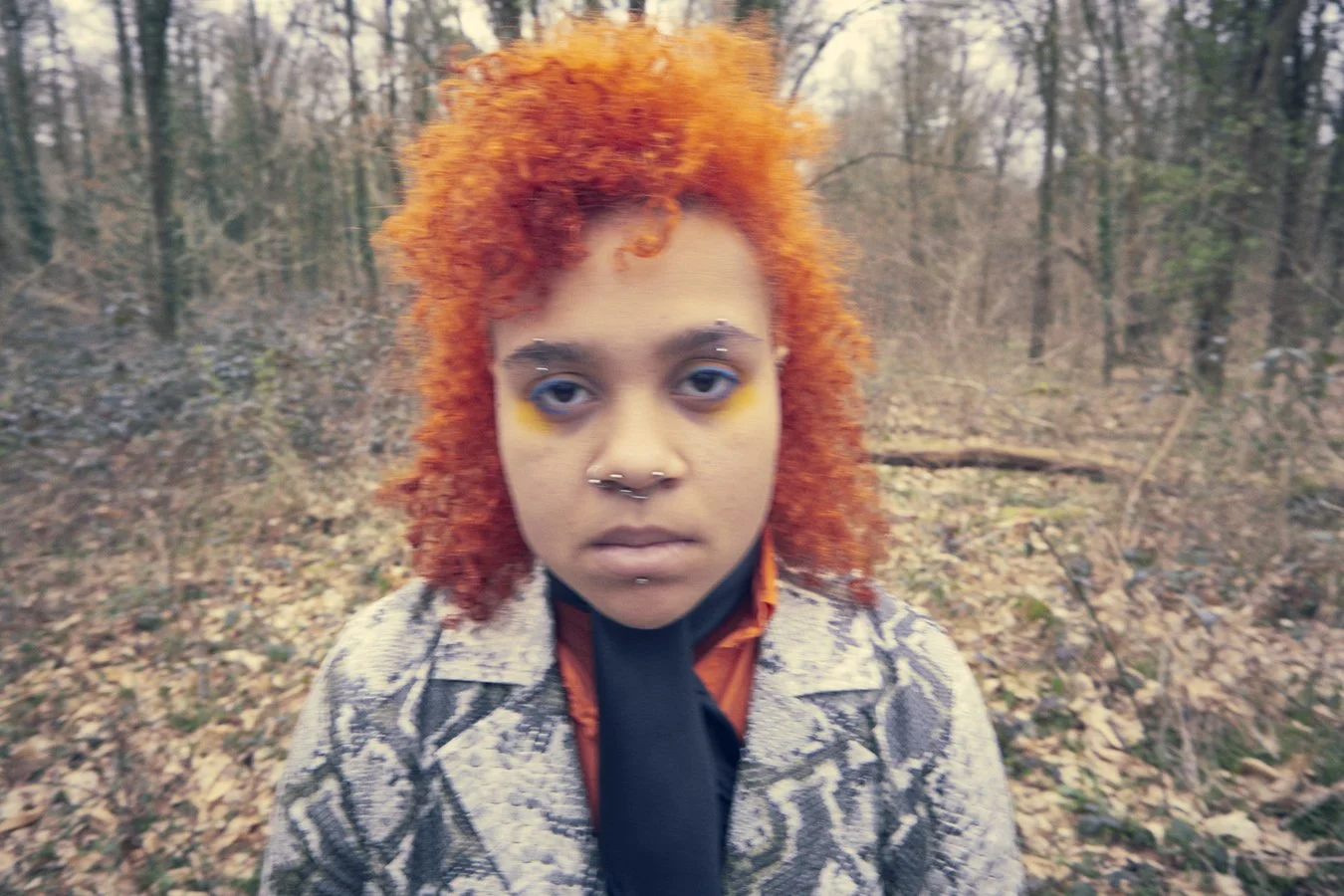 wide angle portrait of woman with orange hair