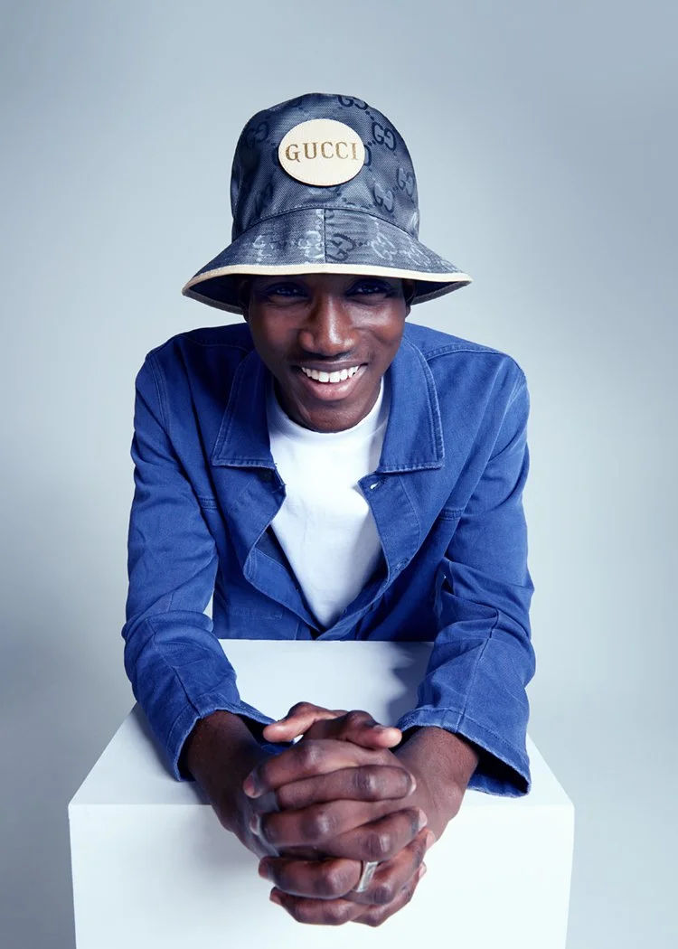 Fashion portrait of man in hat smiling