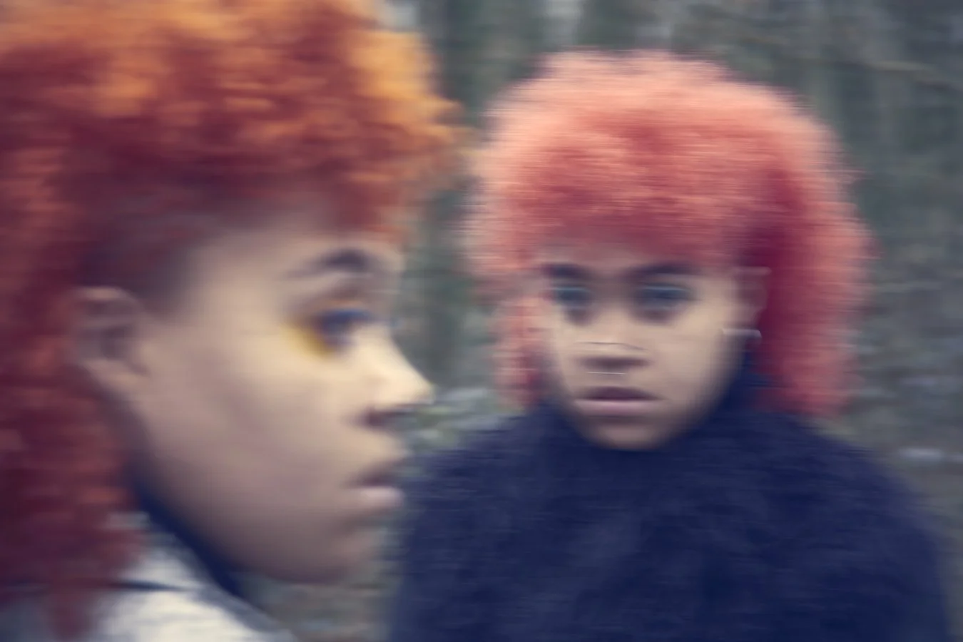 cropped blurred portrait of sisters 