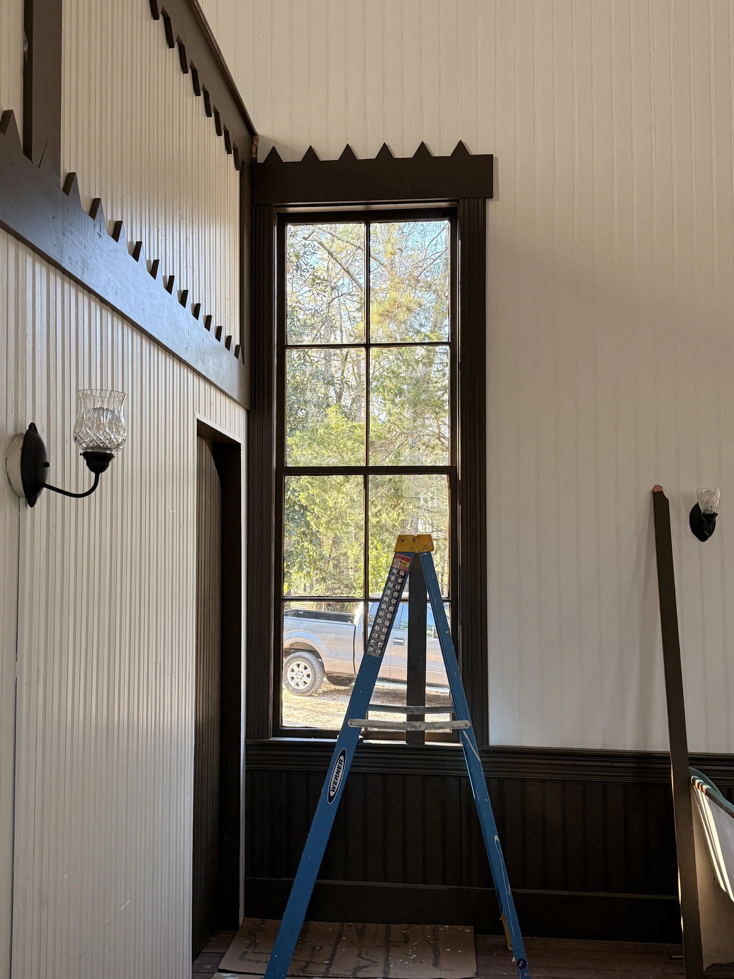 First refurbished window reinstalled - trim and pediment added